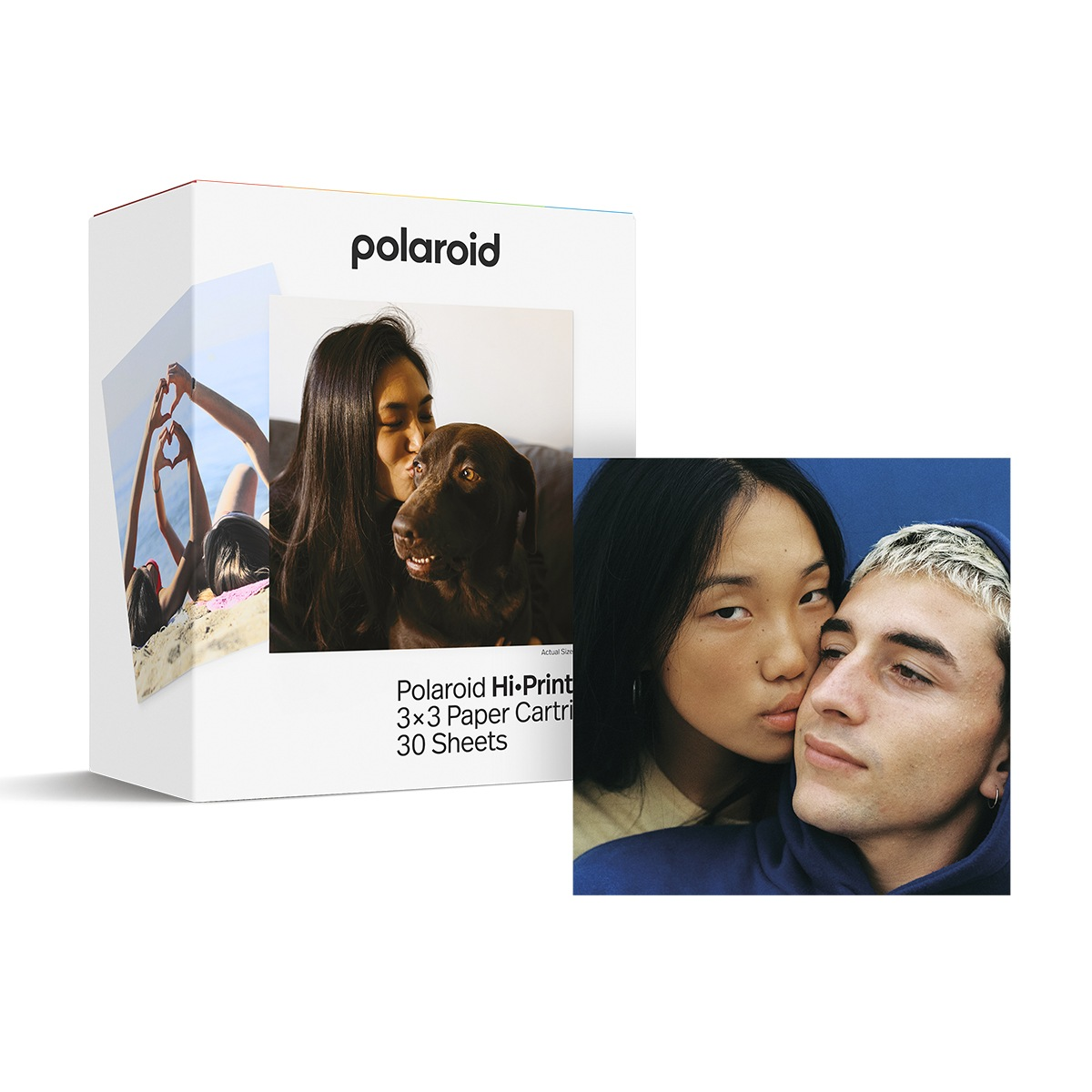 Caja Polaroid con fotos de una mujer y un perro, y una pareja sobre fondo azul.