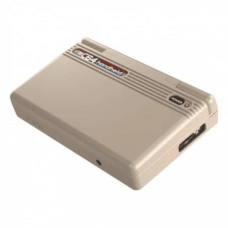 Dispositivo portátil C64 color canela con botón de encendido y puerto USB.