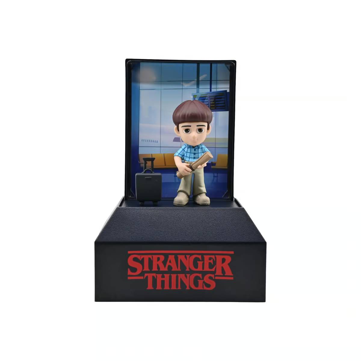 Figura de Stranger Things de un niño en el aeropuerto con maleta y rollo.