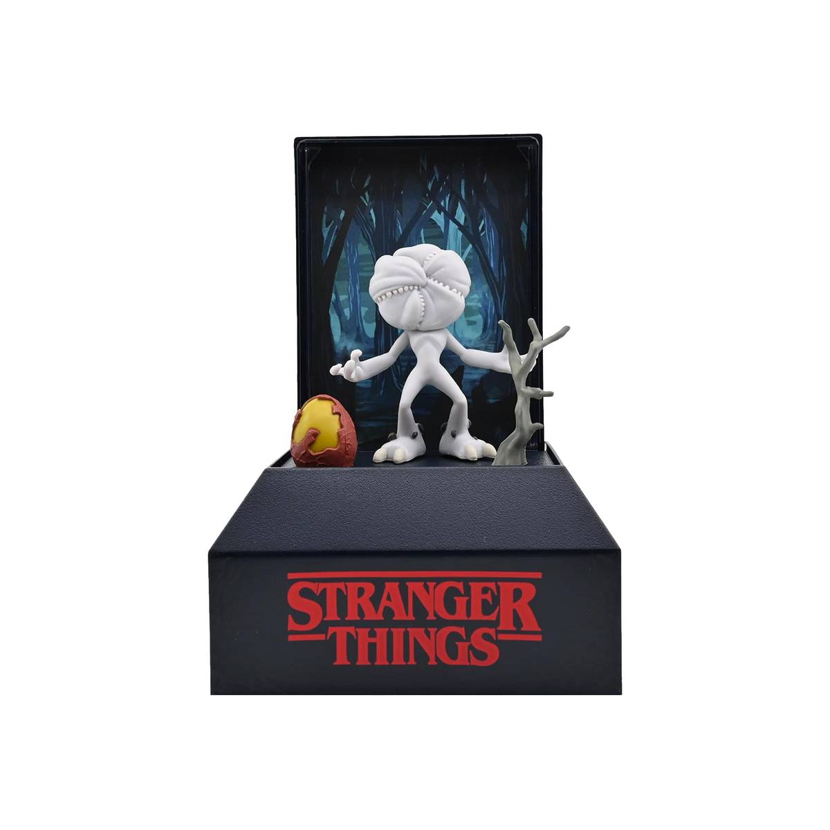 Figura blanca de Demogorgon con huevo y árbol en caja negra de Stranger Things.