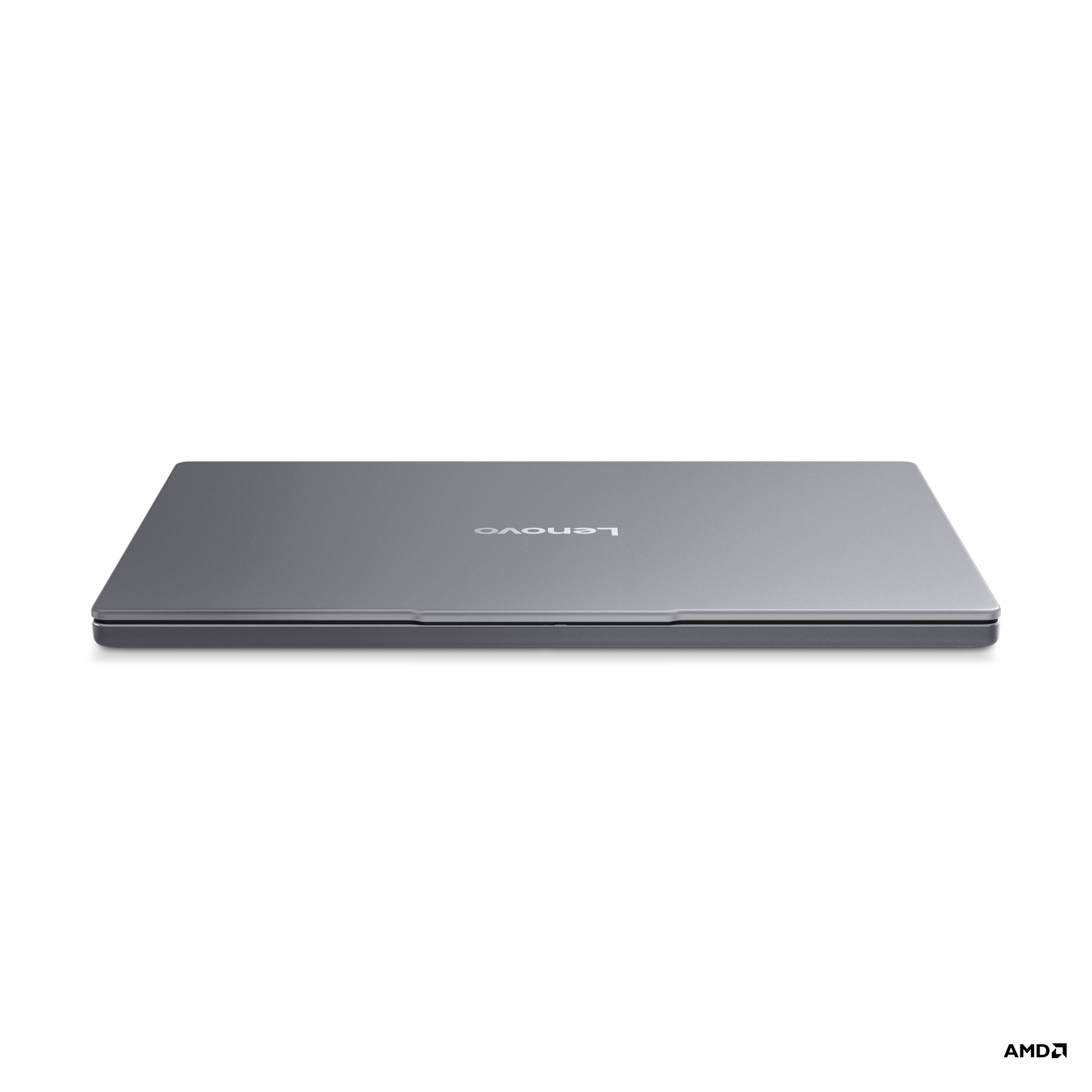 Kapalı gri Lenovo dizüstü bilgisayar siyah arka planda.