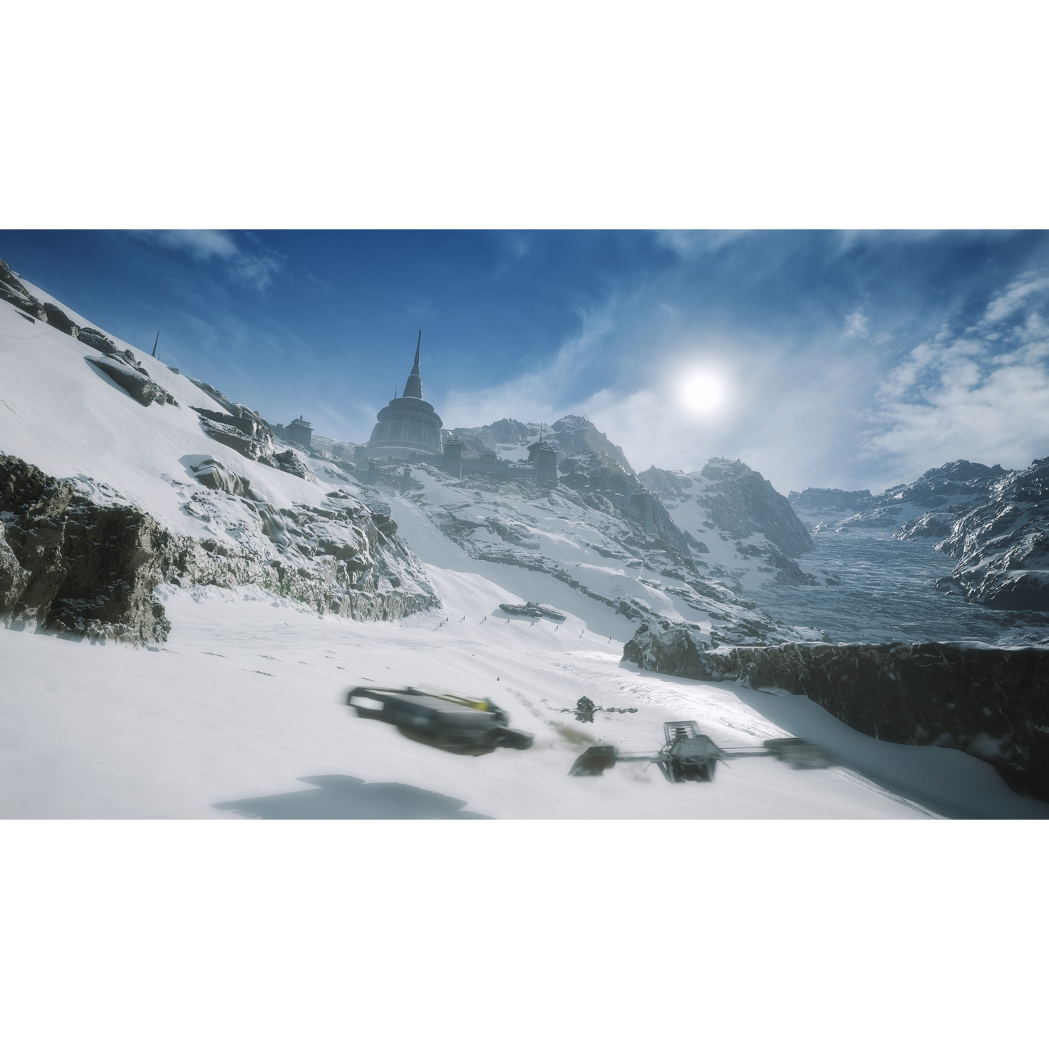 Montagnes enneigées avec une forteresse et des véhicules se déplaçant dans la neige.