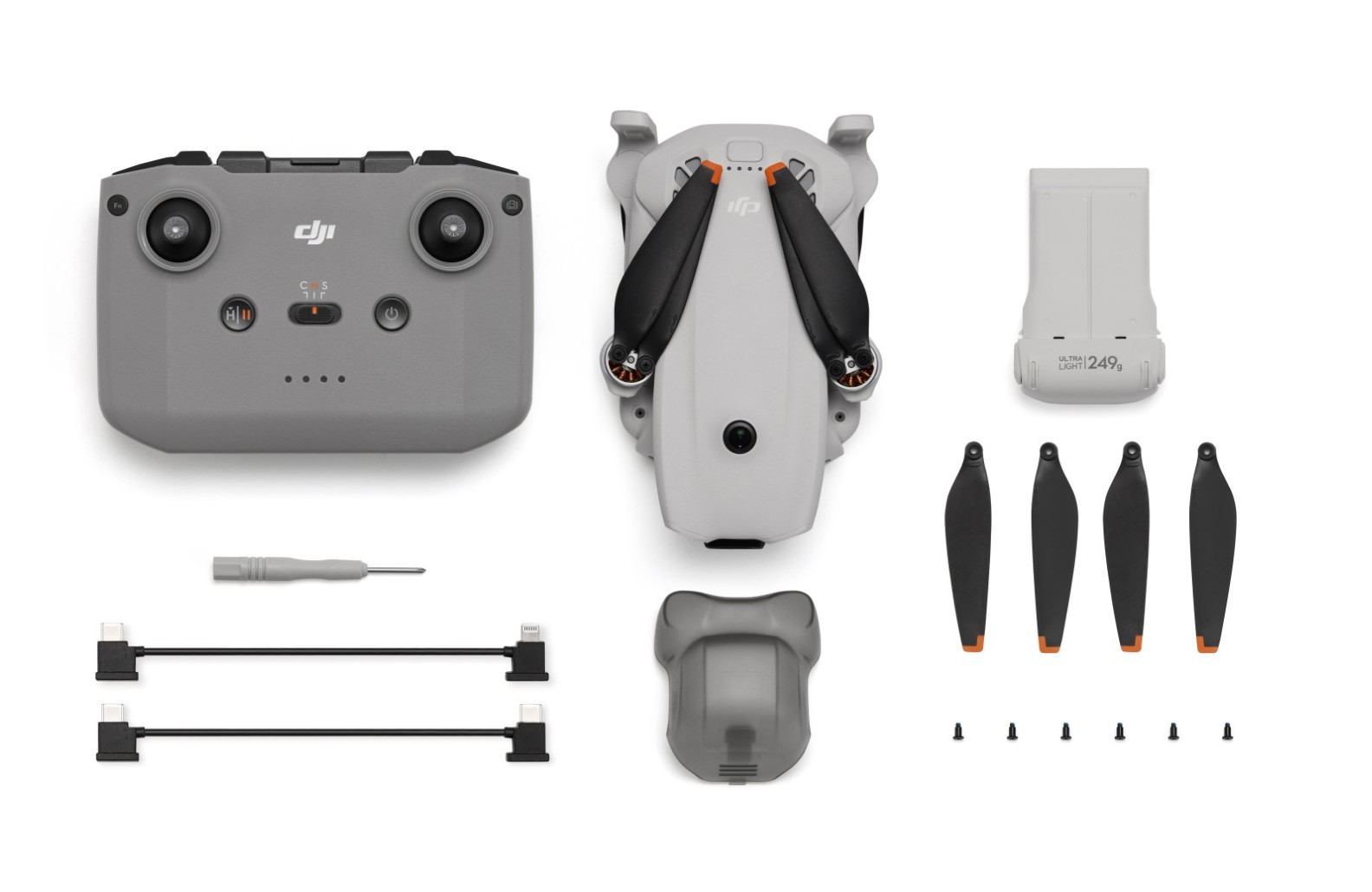 Zestaw drona DJI z kontrolerem, dronem, baterią, śmigłami, kablami i narzędziami.