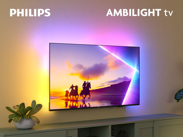 Telewizor Philips Ambilight wyświetlający scenę krajobrazową z jeźdźcami o zachodzie słońca.