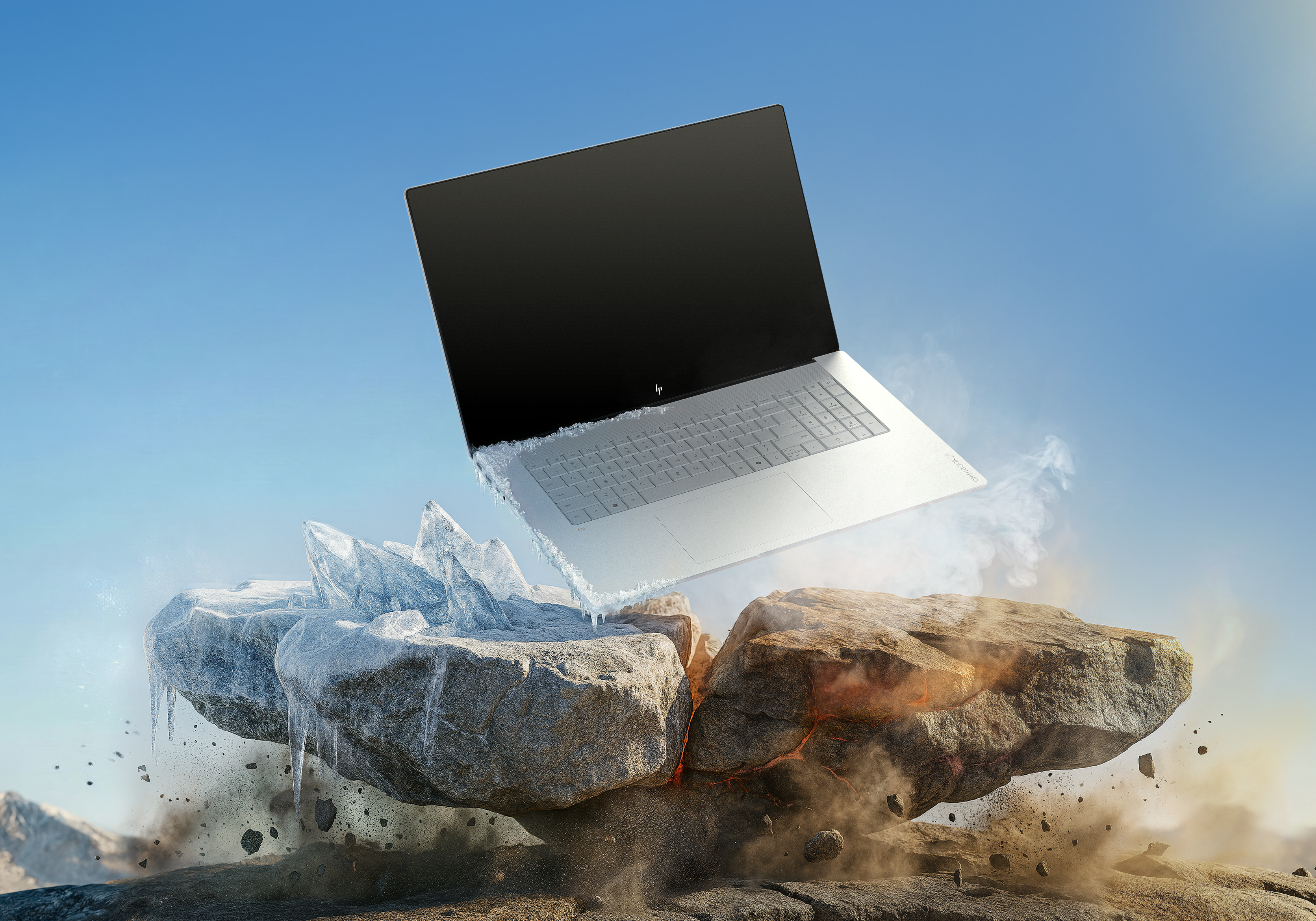 Laptop unosi się nad lodem i ogniem, otoczony dymem i gruzami.