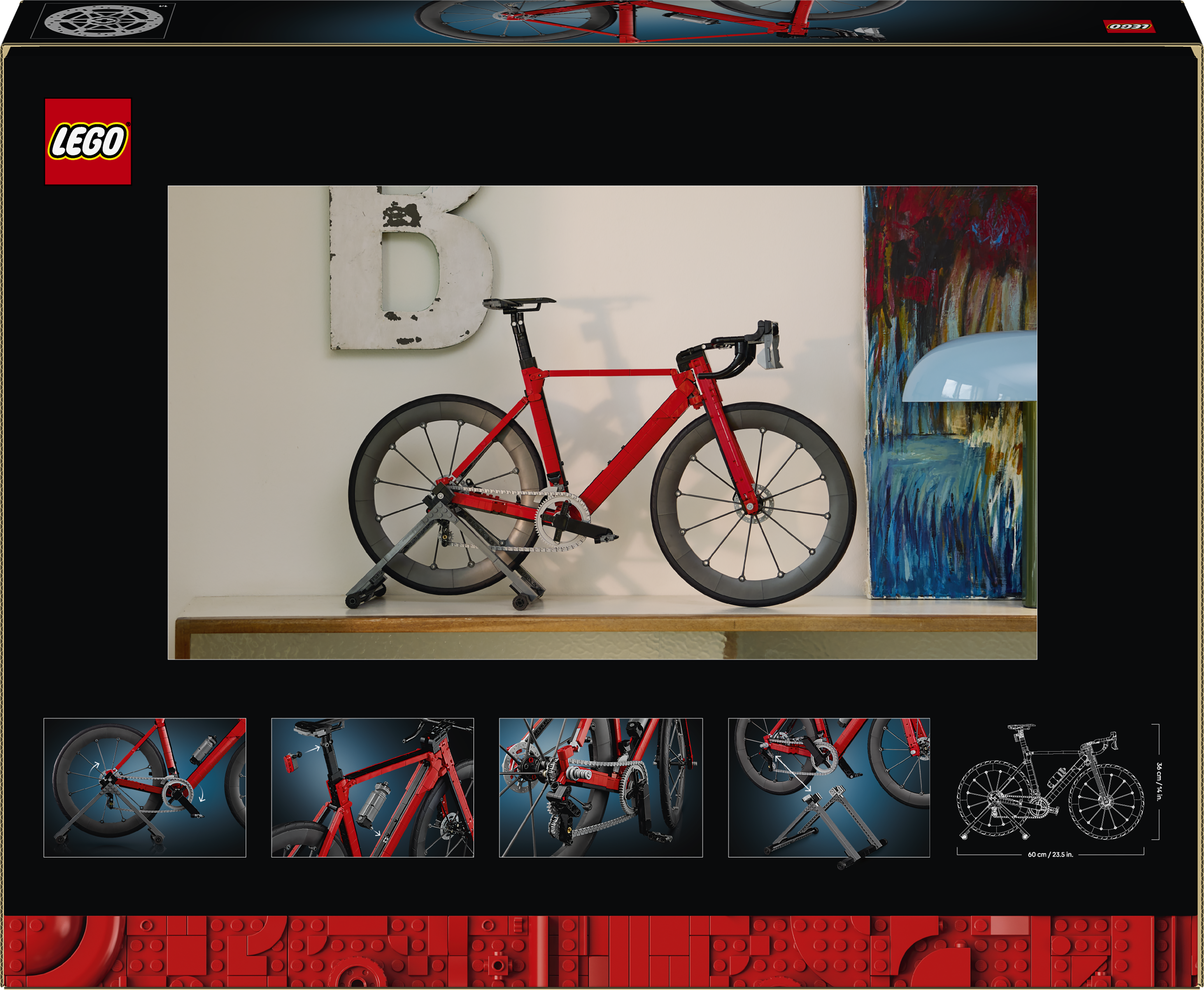 Ein rotes Rennrad auf einem Ständer vor einer Wand mit Kunst.