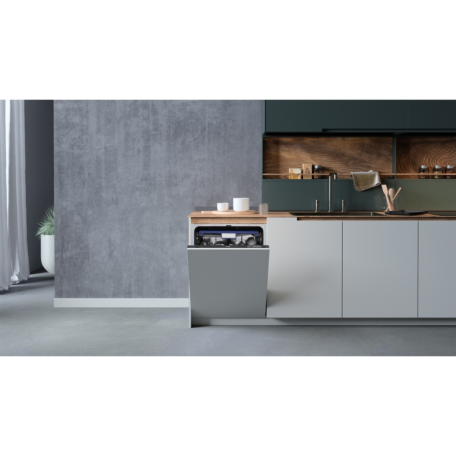 A gray dishwasher with an open door in a modern kitchen with a concrete wall.