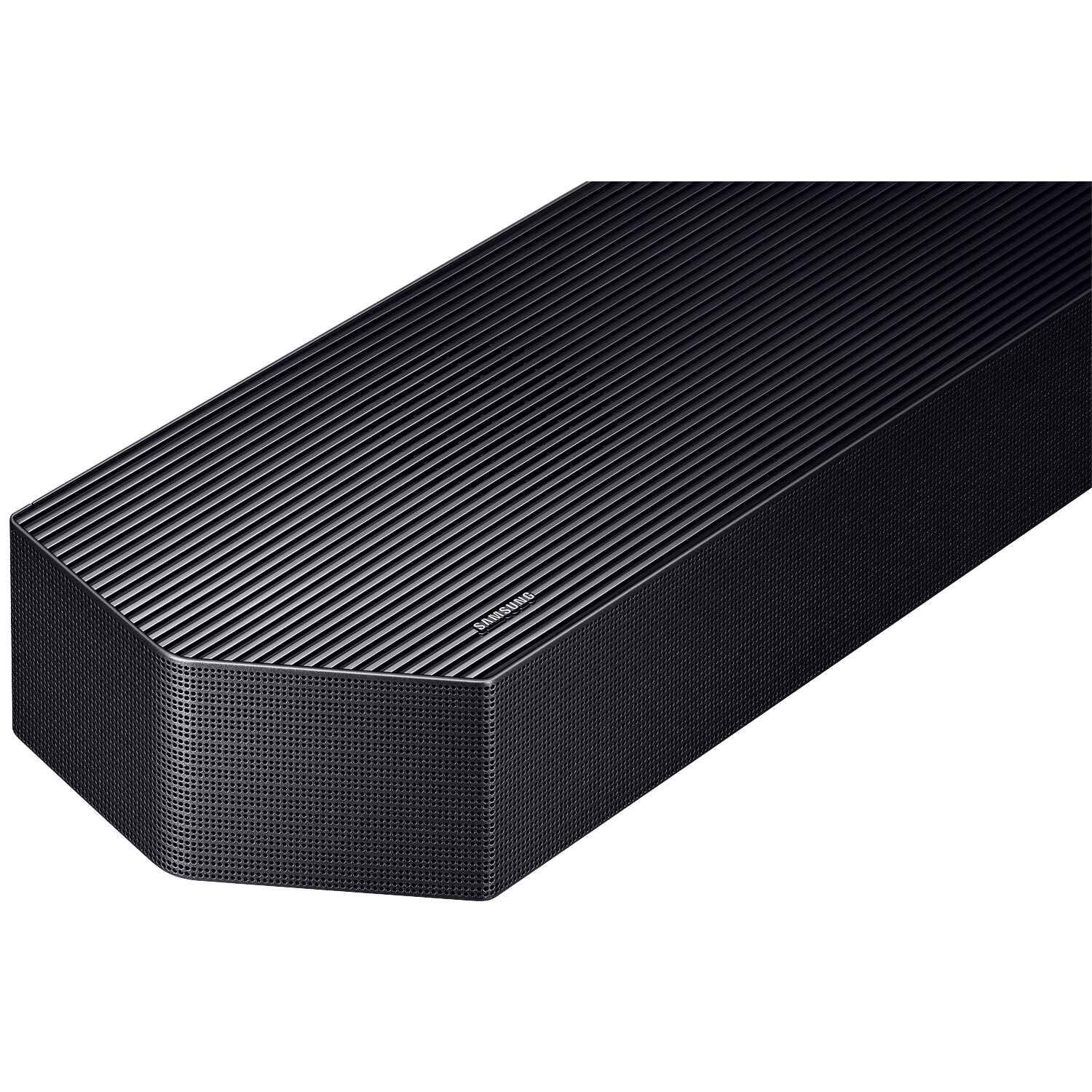A sleek, dark gray Samsung soundbar with a ribbed top and perforated front rests on a black surface.