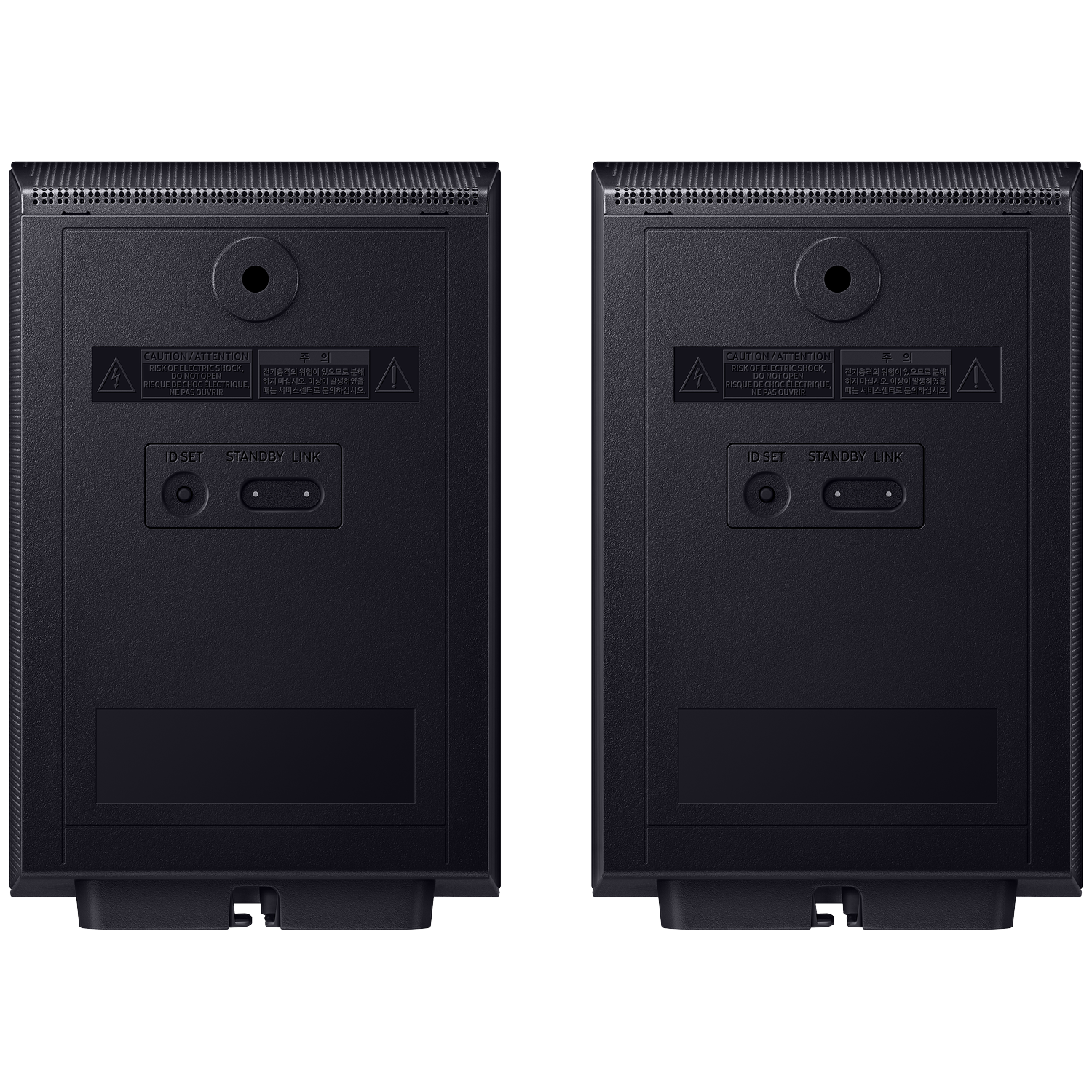 Back of two black speakers showing ports and warning labels.