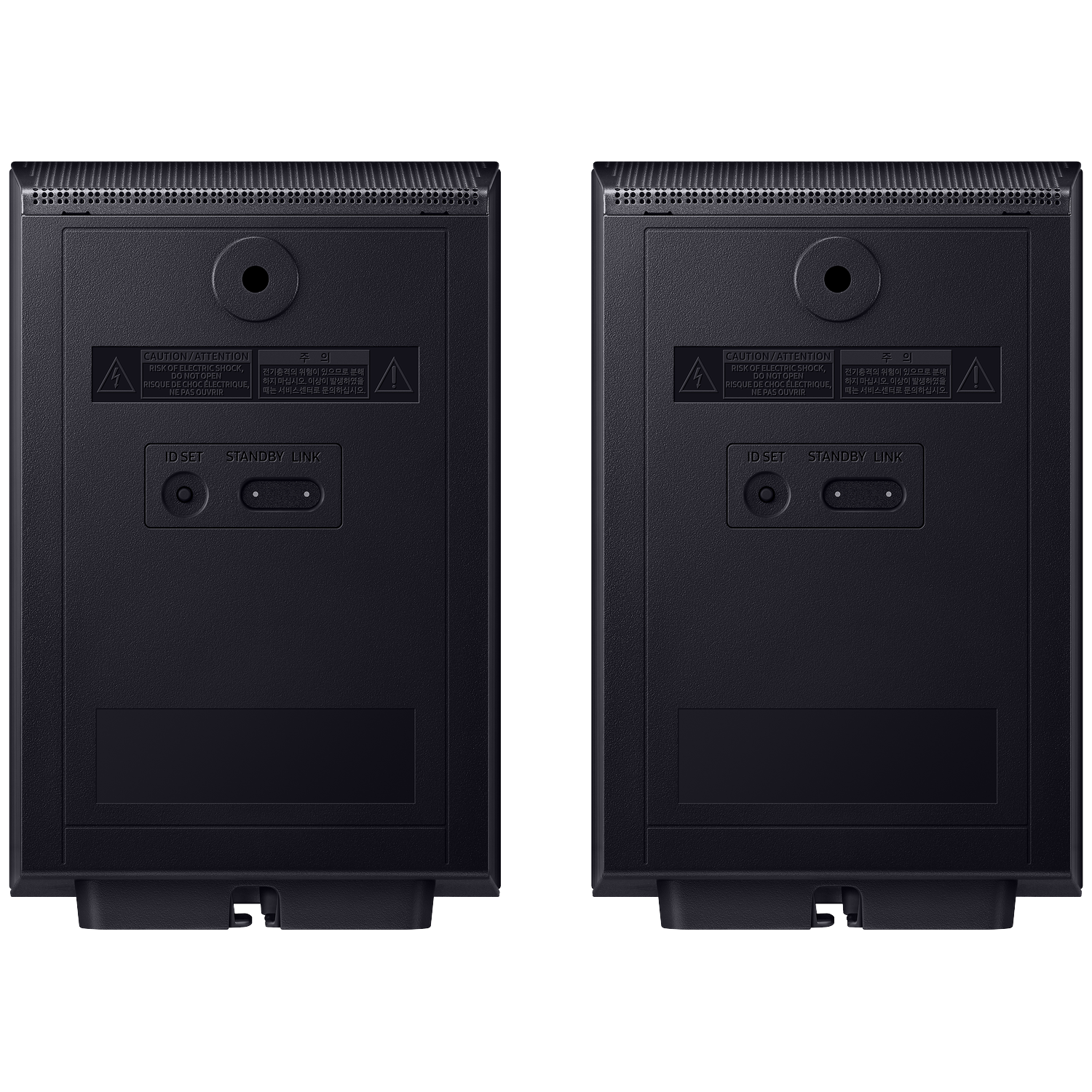 Back view of two black speakers, showing warning labels and ports.