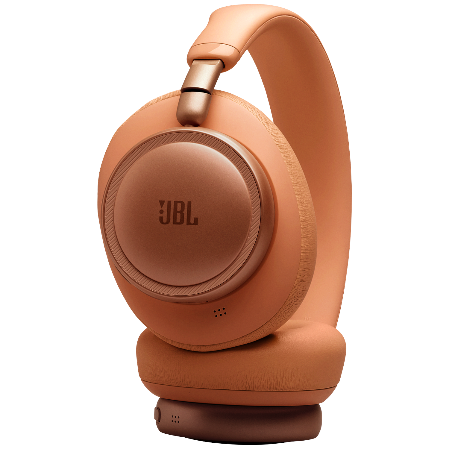 Orange JBL headphones with gold accents on a black background.