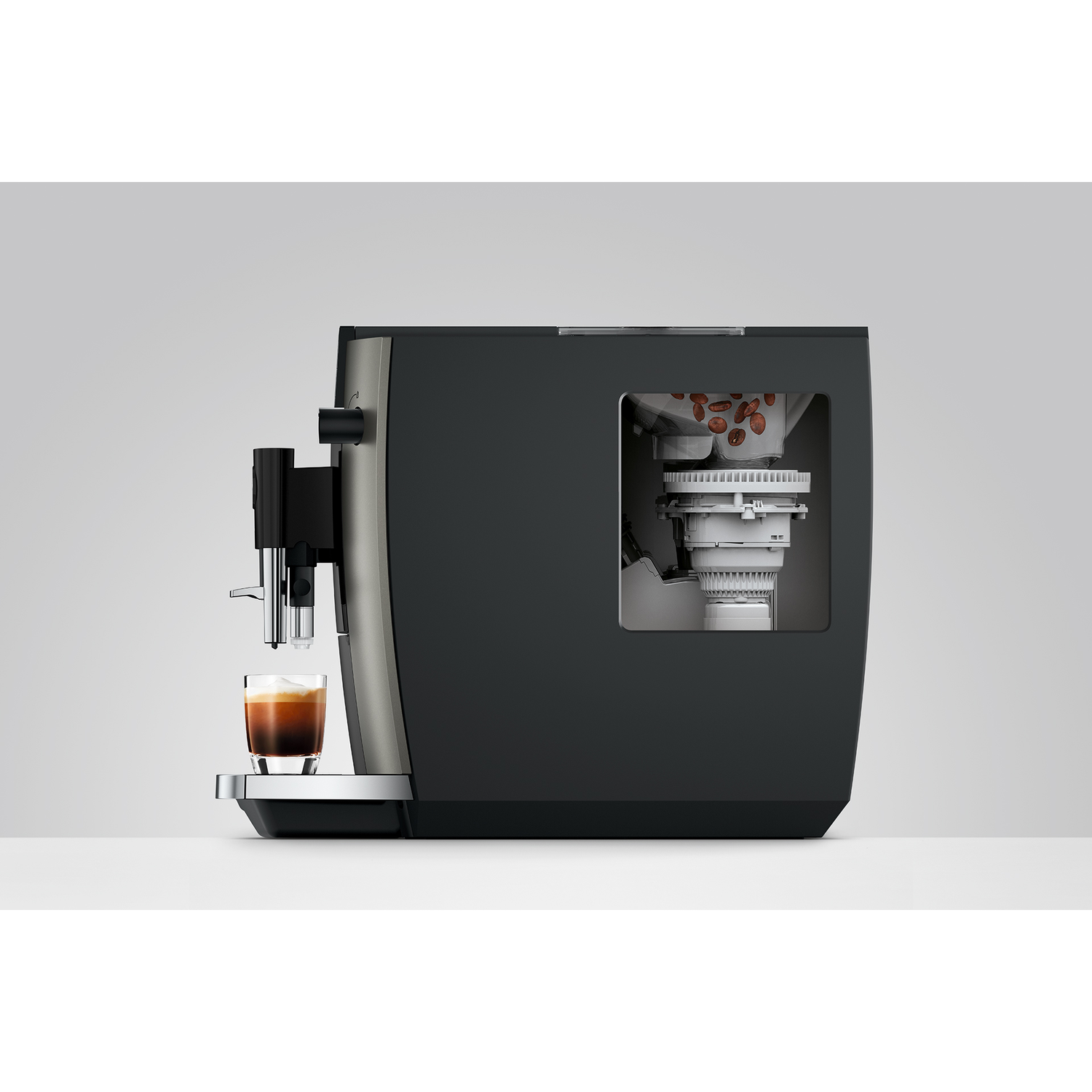 Koffiezetapparaat met espressoglas, bonenreservoir zichtbaar.