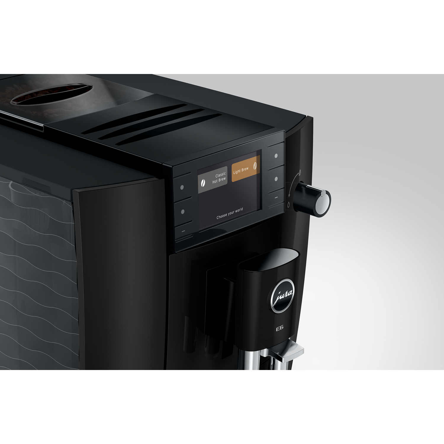 Zwarte koffiemachine met touchscreen en draaiknop. Jura E6 logo.