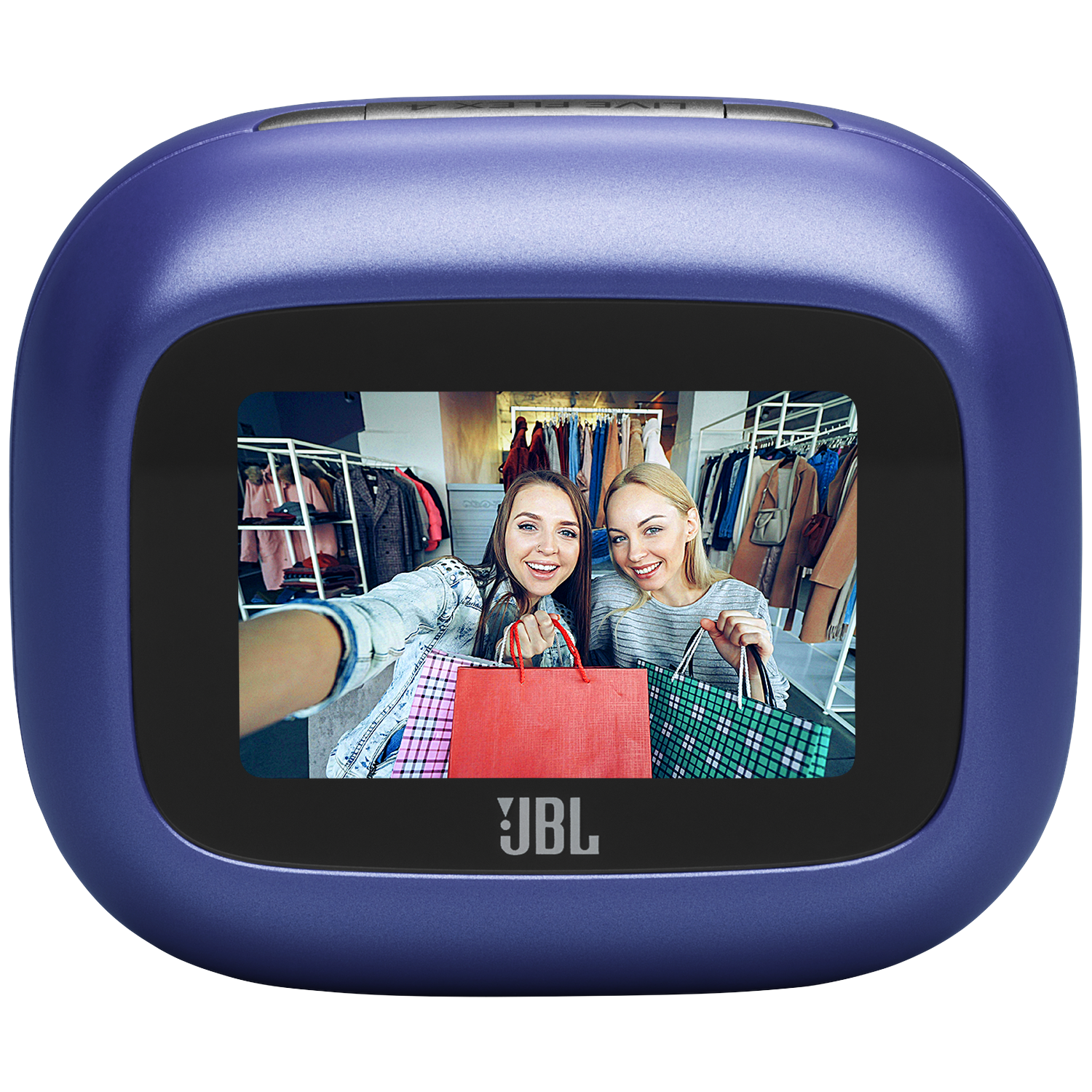 Two women take a selfie with shopping bags in a store.