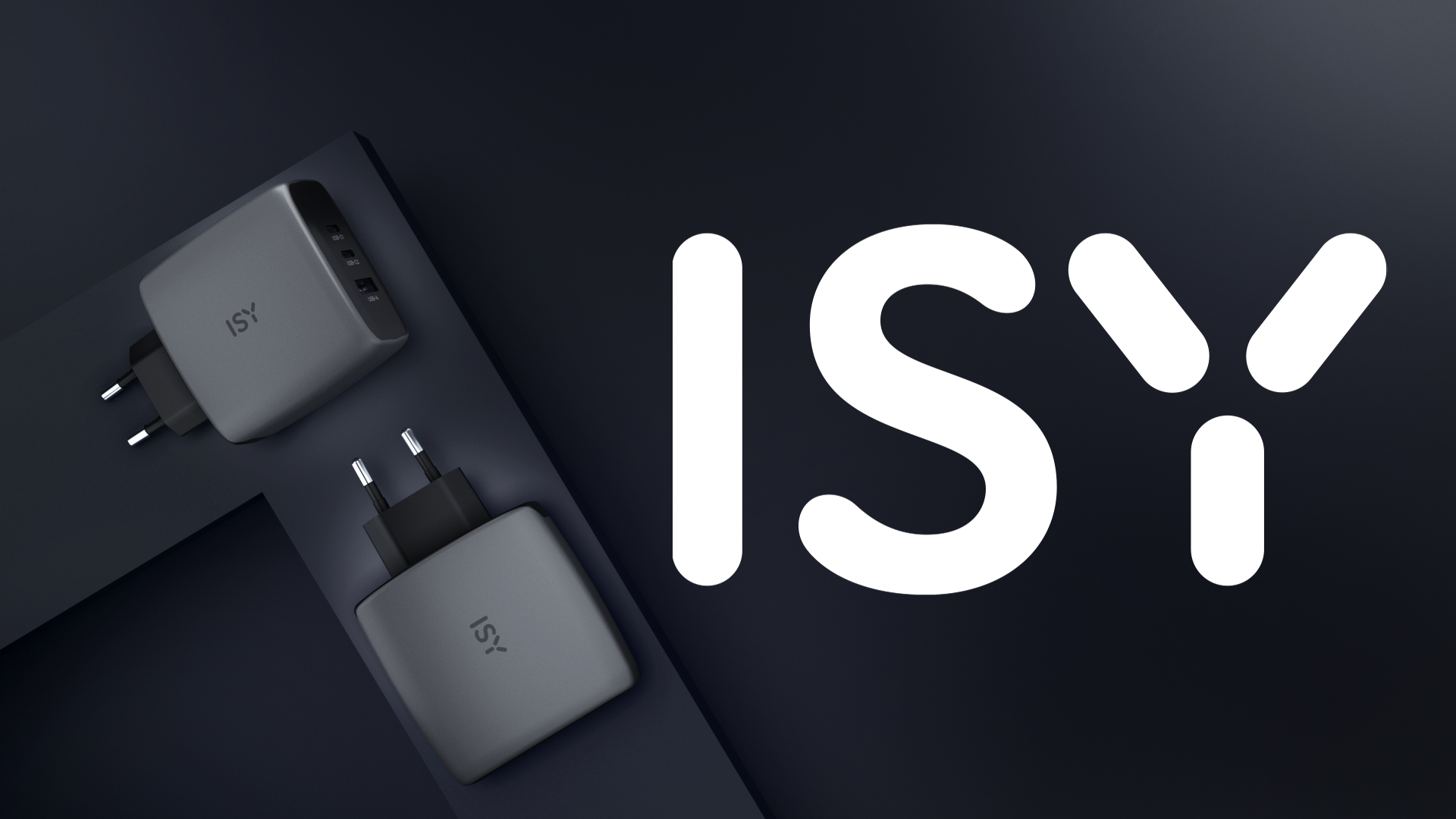 Zwei graue ISY-Ladegeräte mit USB-Anschlüssen auf dunklem Hintergrund.