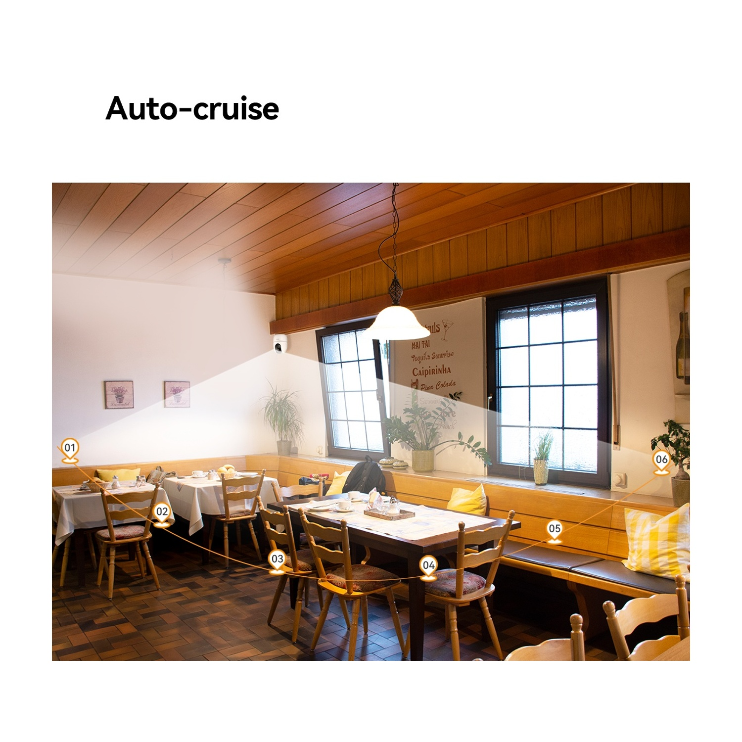 Interno di ristorante con tavoli, sedie e finestre.