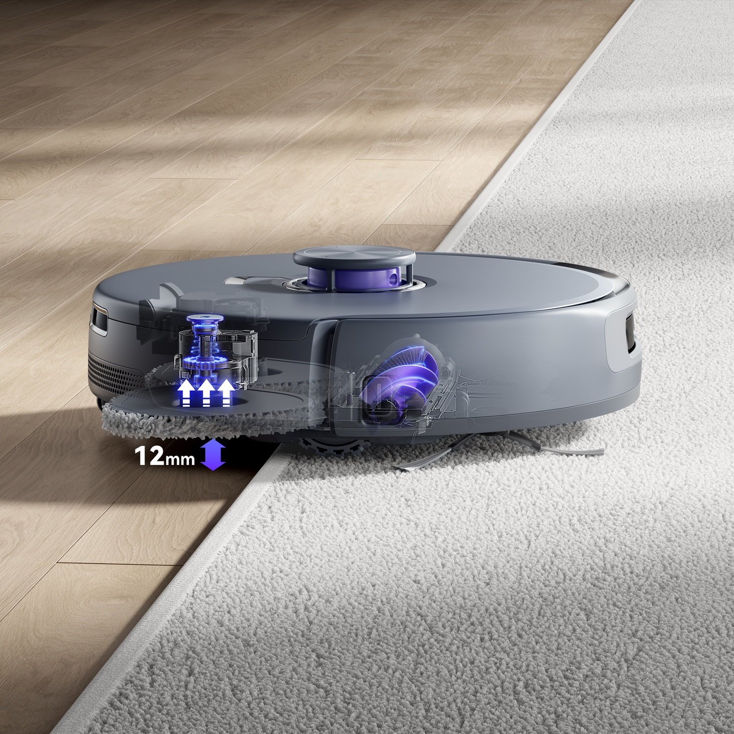 Robot aspirapolvere supera bordo 12mm da legno a tappeto, meccanismo visibile.