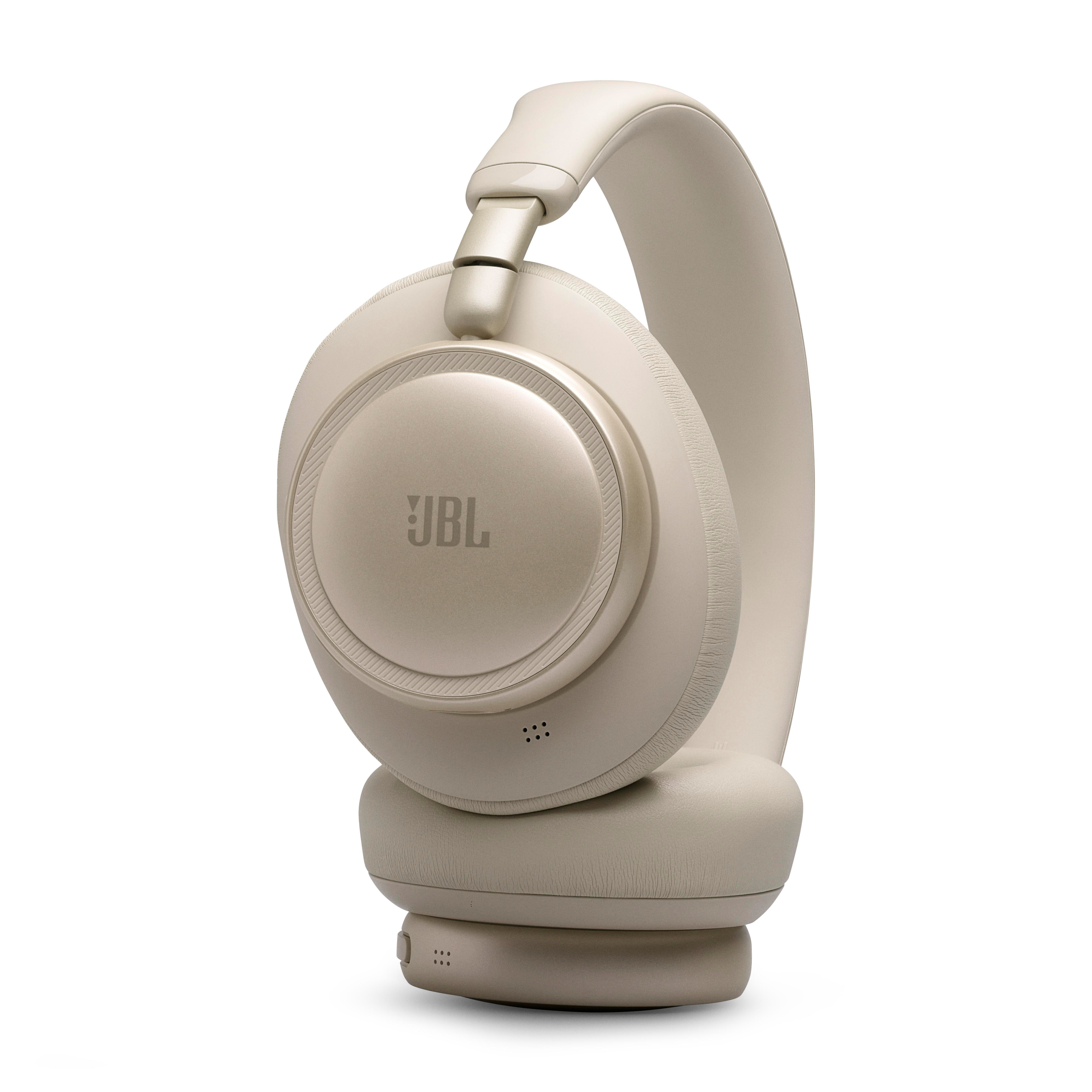 Beige JBL Kopfhörer mit Ohrumschließung und gepolstertem Kopfbügel.