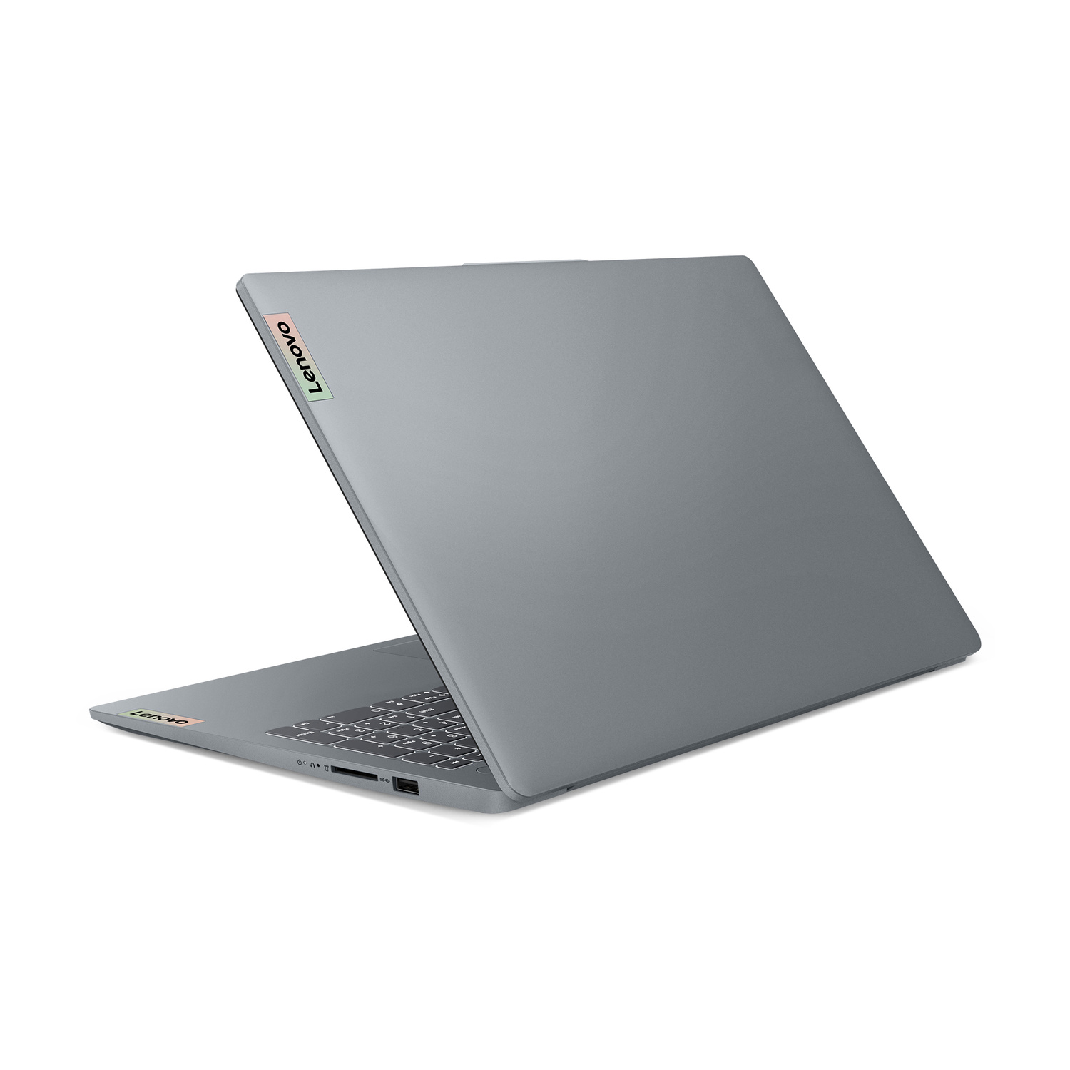 Laptop Lenovo grigio, visto di lato, mostra tastiera e porte.