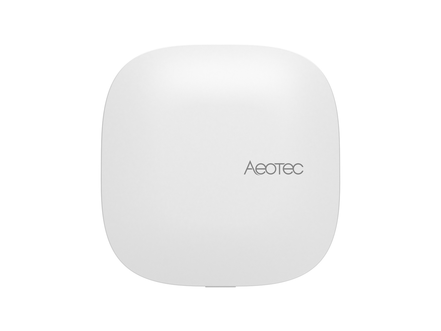Ein weißes, abgerundetes quadratisches Gerät mit dem Aeotec-Logo.