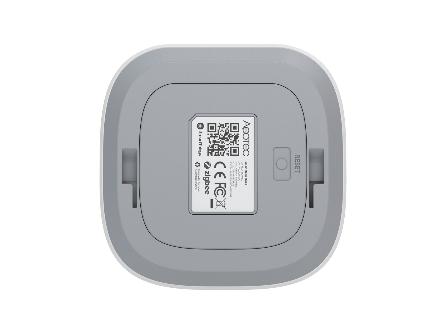 Unterseite eines weißen Smart Home Hubs mit Reset-Taste und Zigbee-Logo.