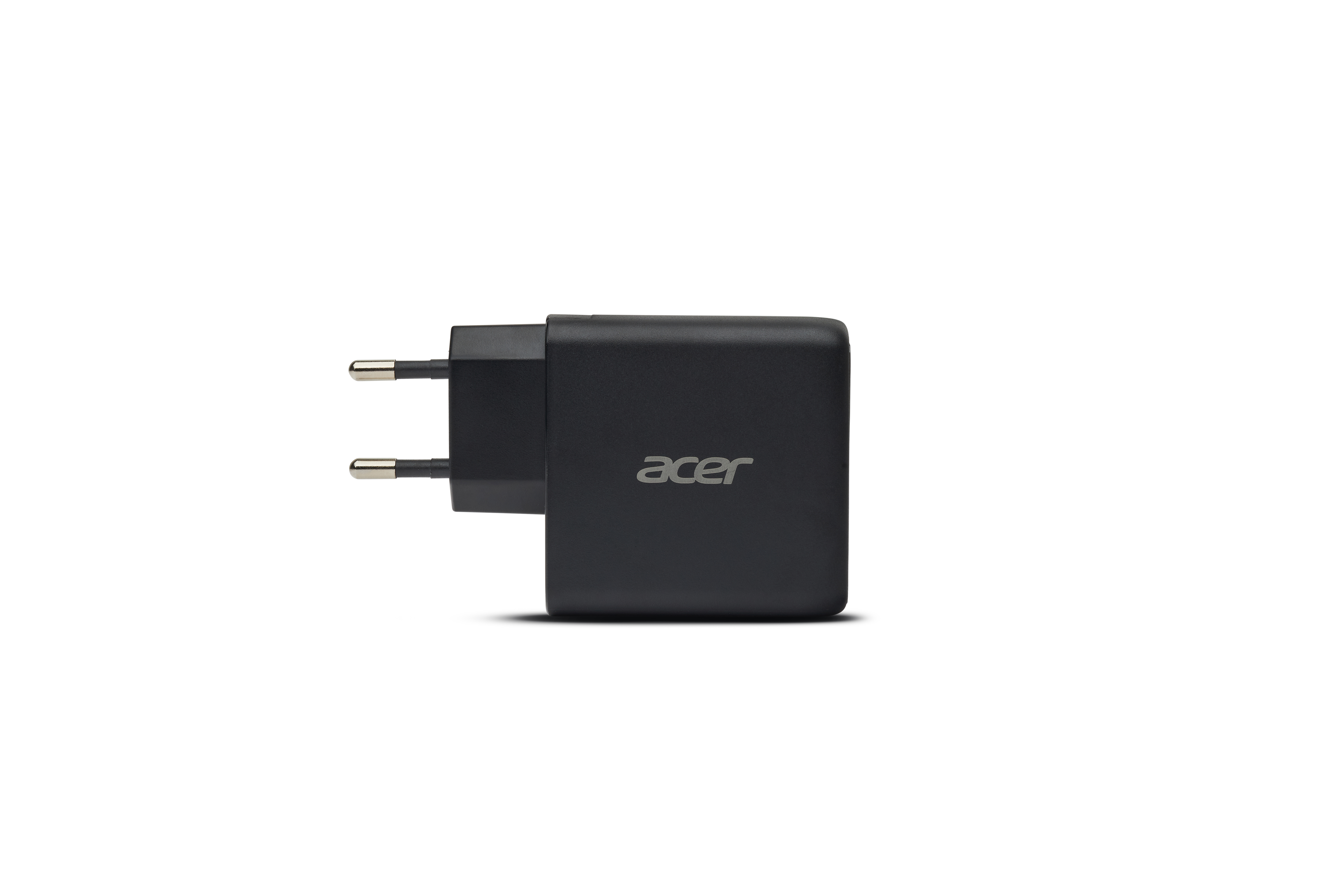 Ein schwarzes Acer Netzteil mit zwei silbernen Stiften.