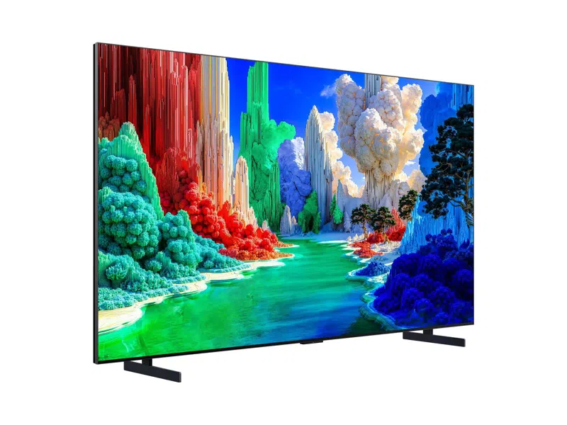 Egy modern televízió élénk színű szürreális tájképet jelenít meg.