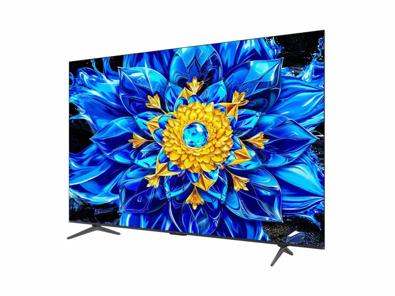 Egy modern TV, amely élénk kék és arany virágmintát jelenít meg a képernyőjén.