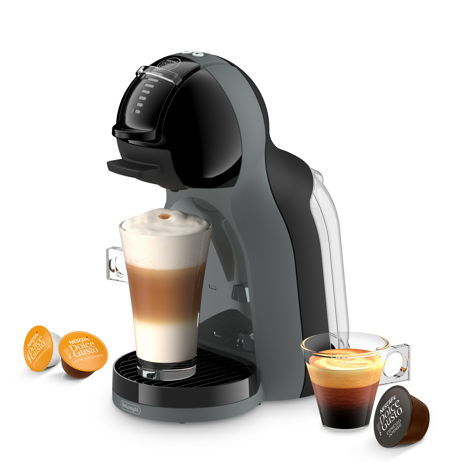 Una cafetera Dolce Gusto gris con dos tazas de café y cápsulas de café al lado.