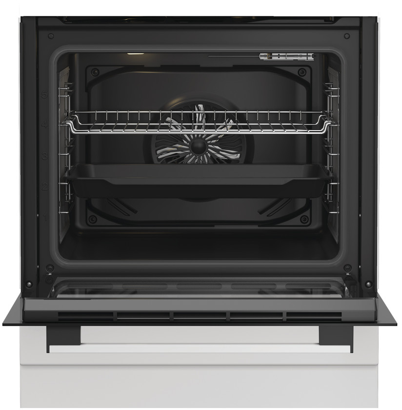 Four encastrable ouvert avec grille et lèchefrite. Ventilateur visible.