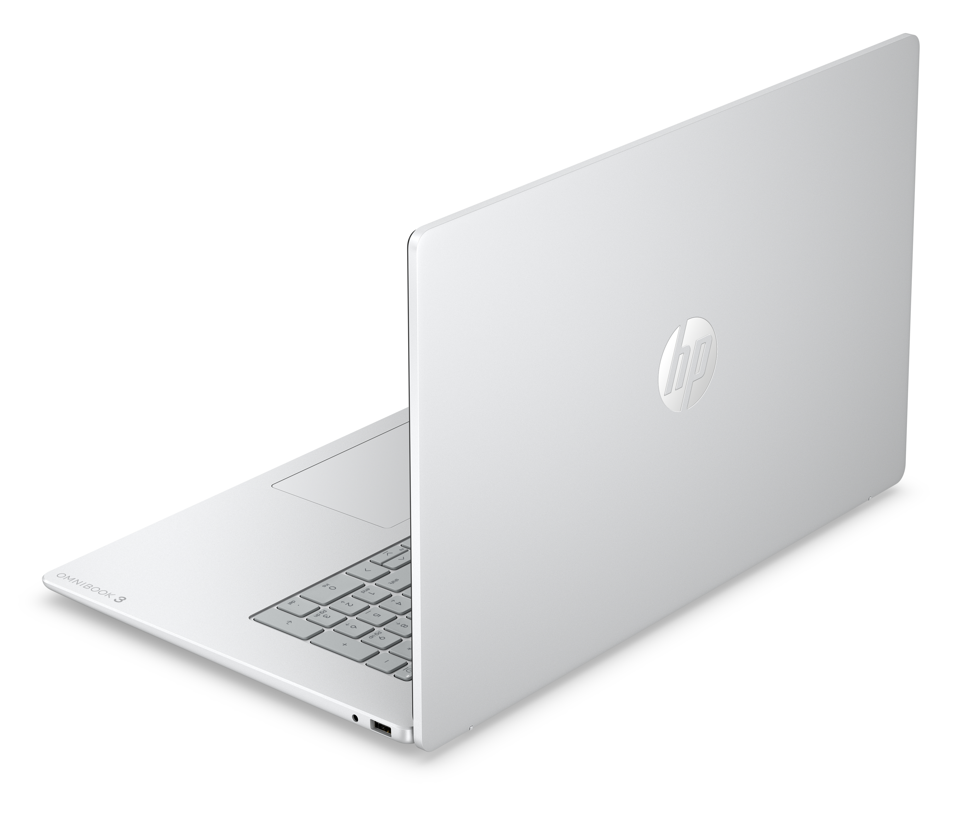 Ein geschlossenes, silbernes HP Omnibook 3 Laptop mit Tastatur und Touchpad.