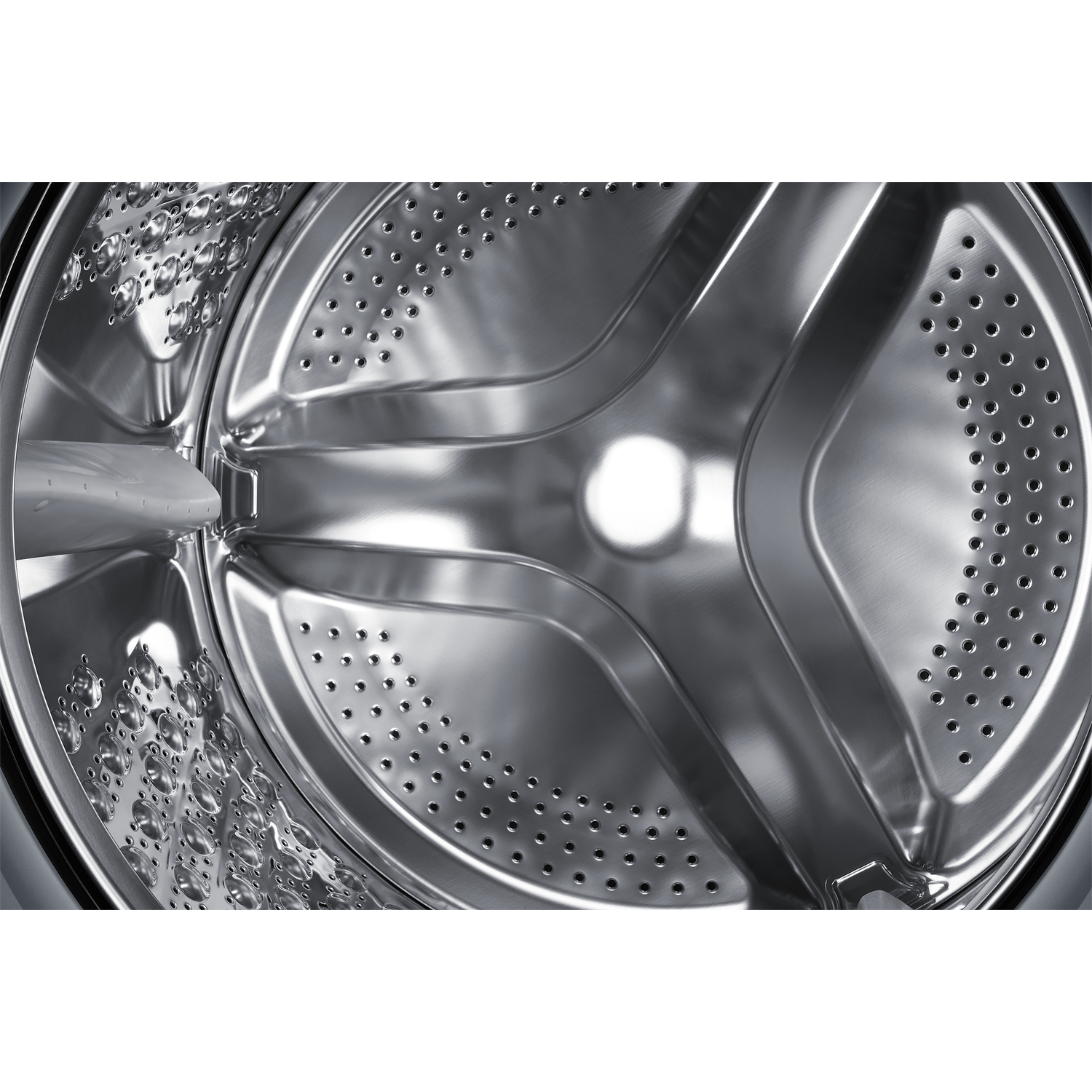 Close-up of a washing machine drum with water droplets.