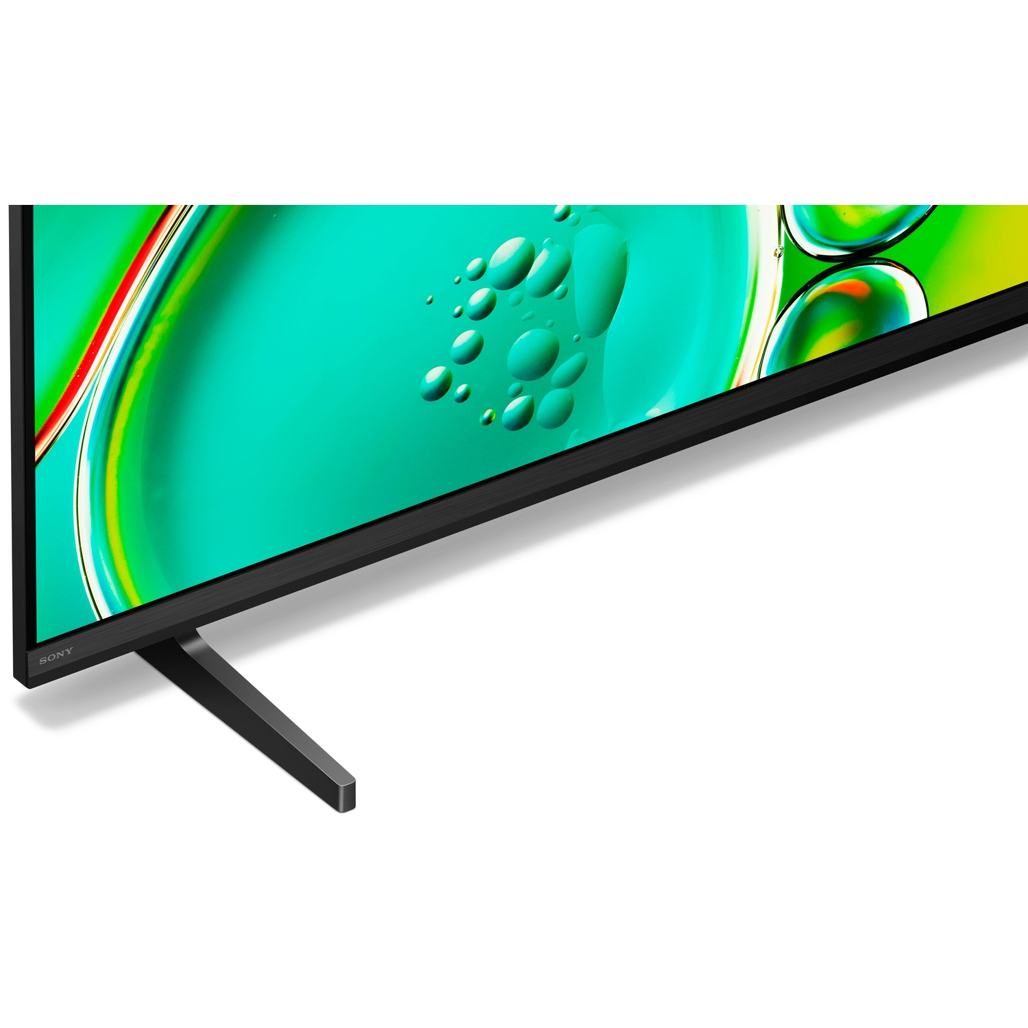 Close-up van een tv-scherm met een levendige groene achtergrond met bubbels.