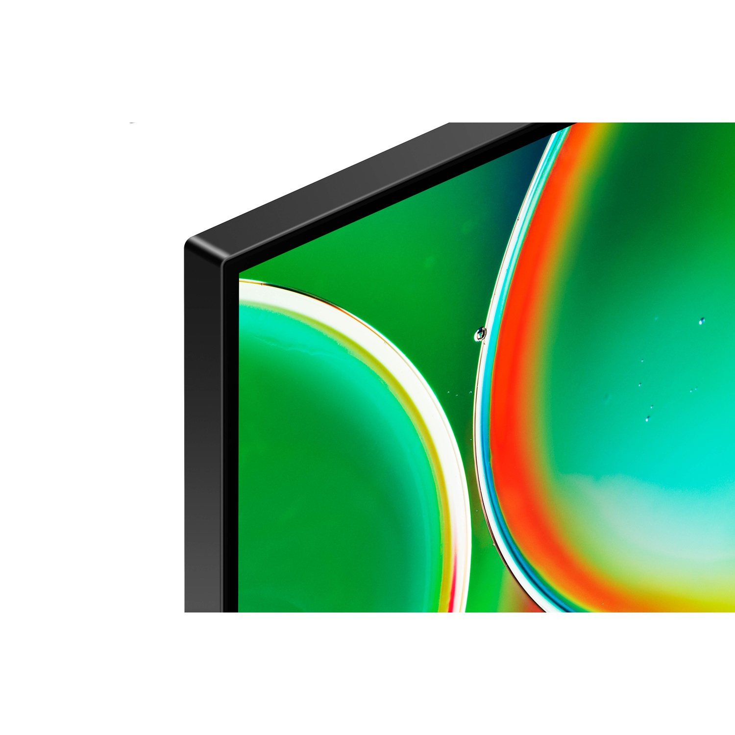 Close-up van een zwarte monitorhoek met een levendige groen-blauwe achtergrond.