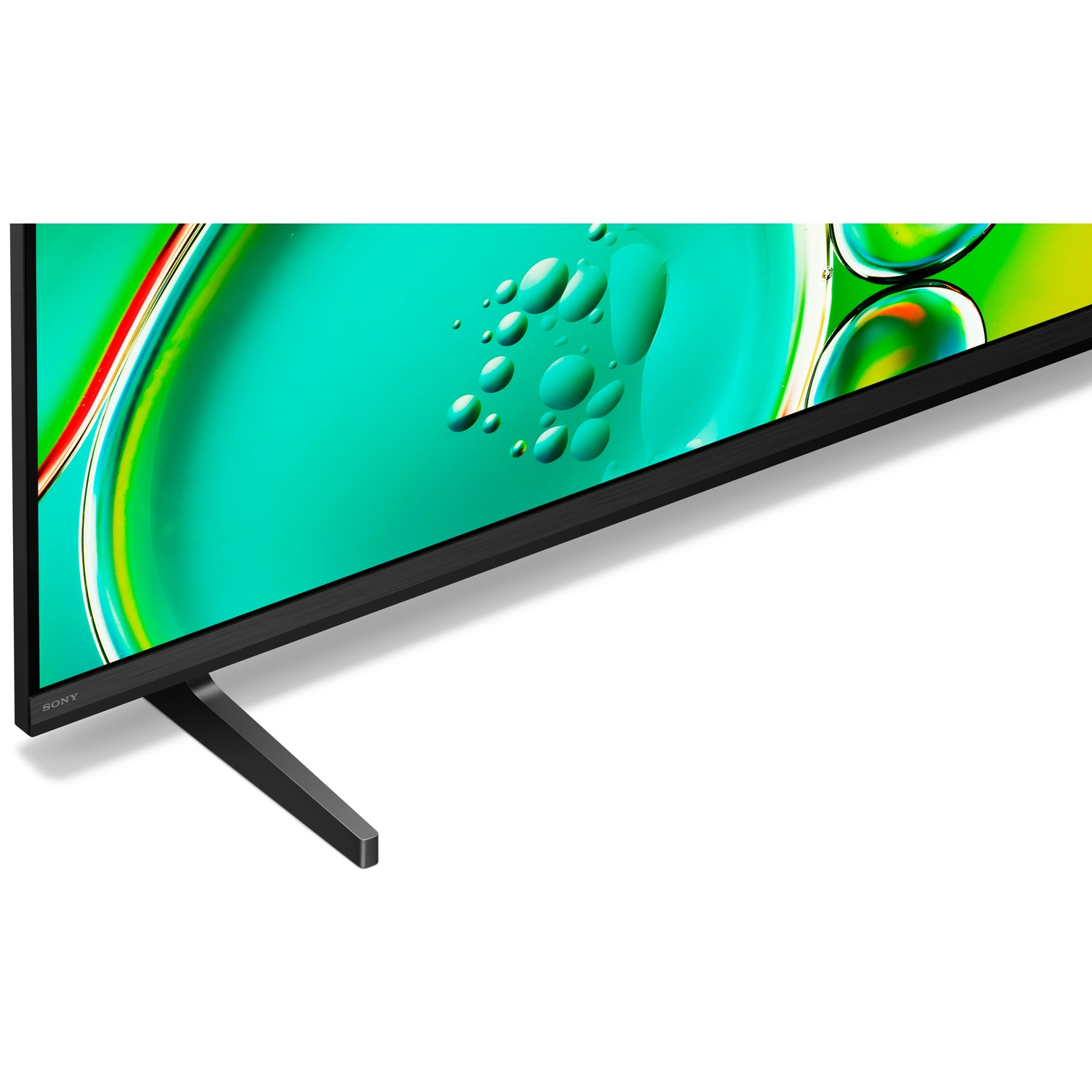 Sony TV met zwarte standaard en groene achtergrond met bellen.