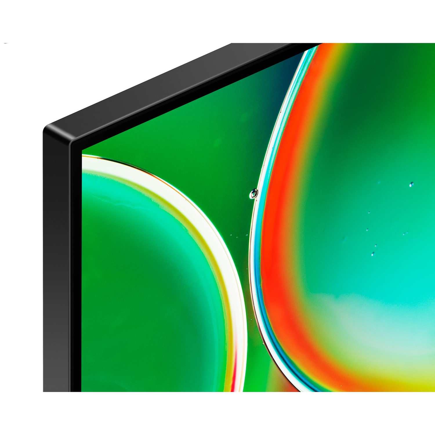 Close-up of a black screen displaying green and colorful circles.