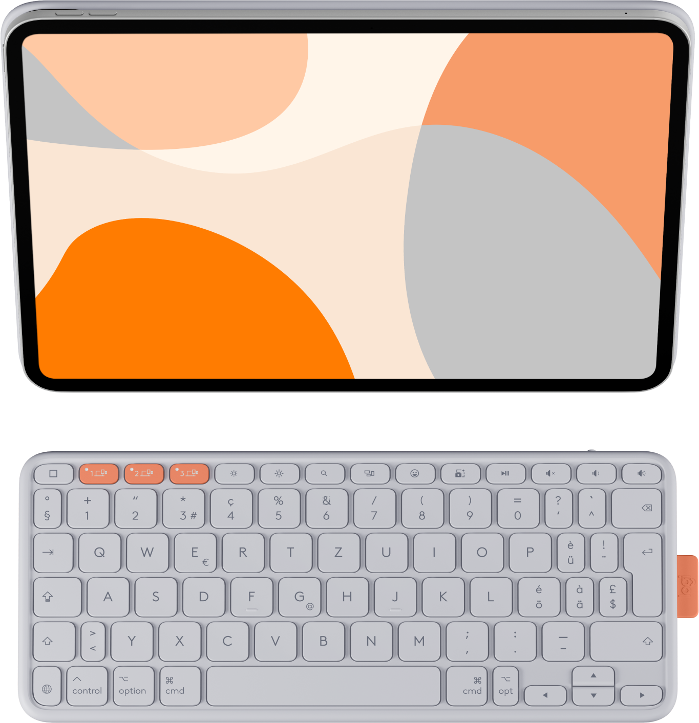 Ein Tablet mit abstrakter orangefarbener Tapete über einer Tastatur.