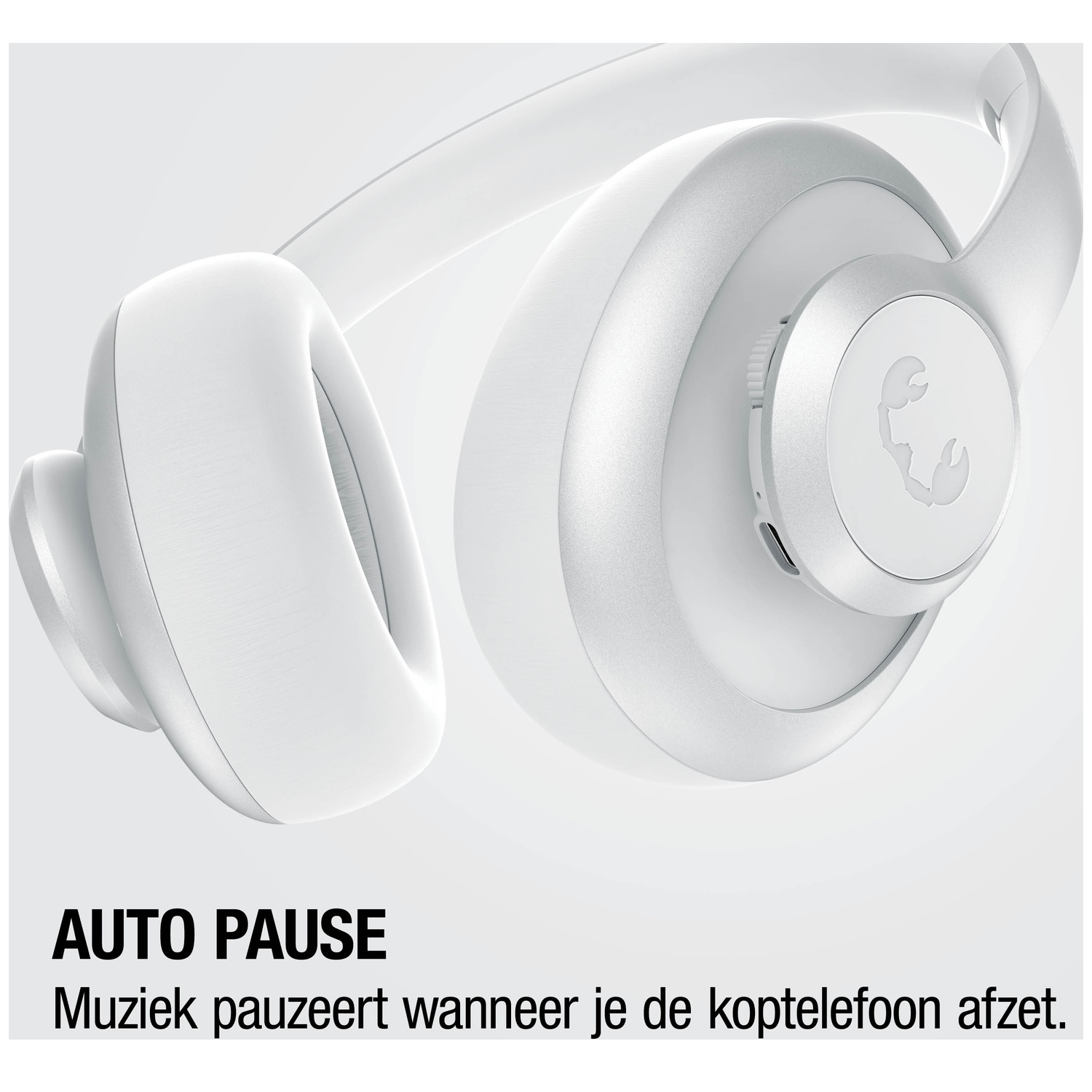 White headphones with a scorpion logo and the text "AUTO PAUSE".