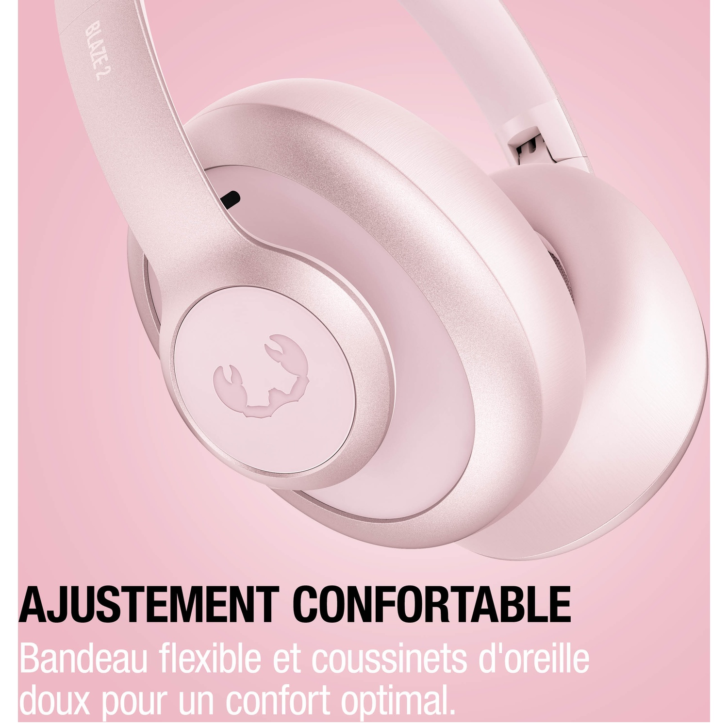 Casque rose avec un logo de crabe stylisé sur le cache-oreille.