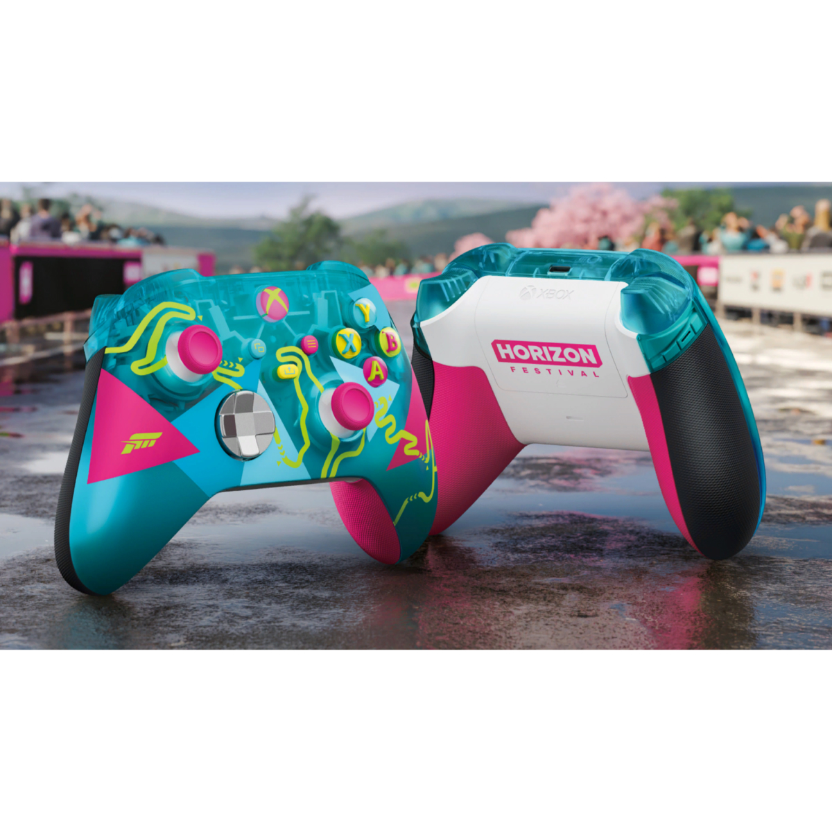 Dwa kontrolery Xbox w kolorze turkusowym i różowym z 