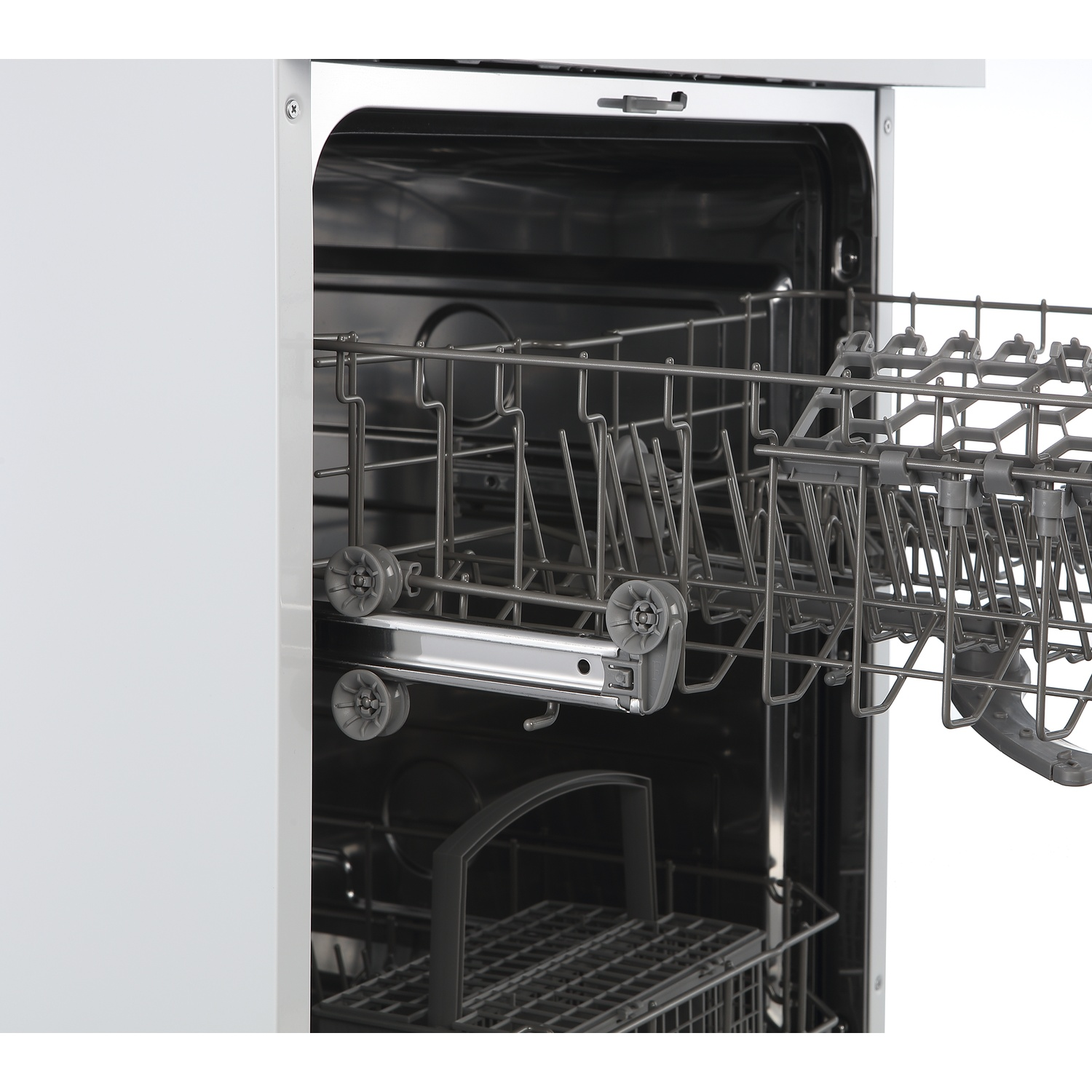 Open dishwasher interior with pull-out cutlery basket and upper dish rack.