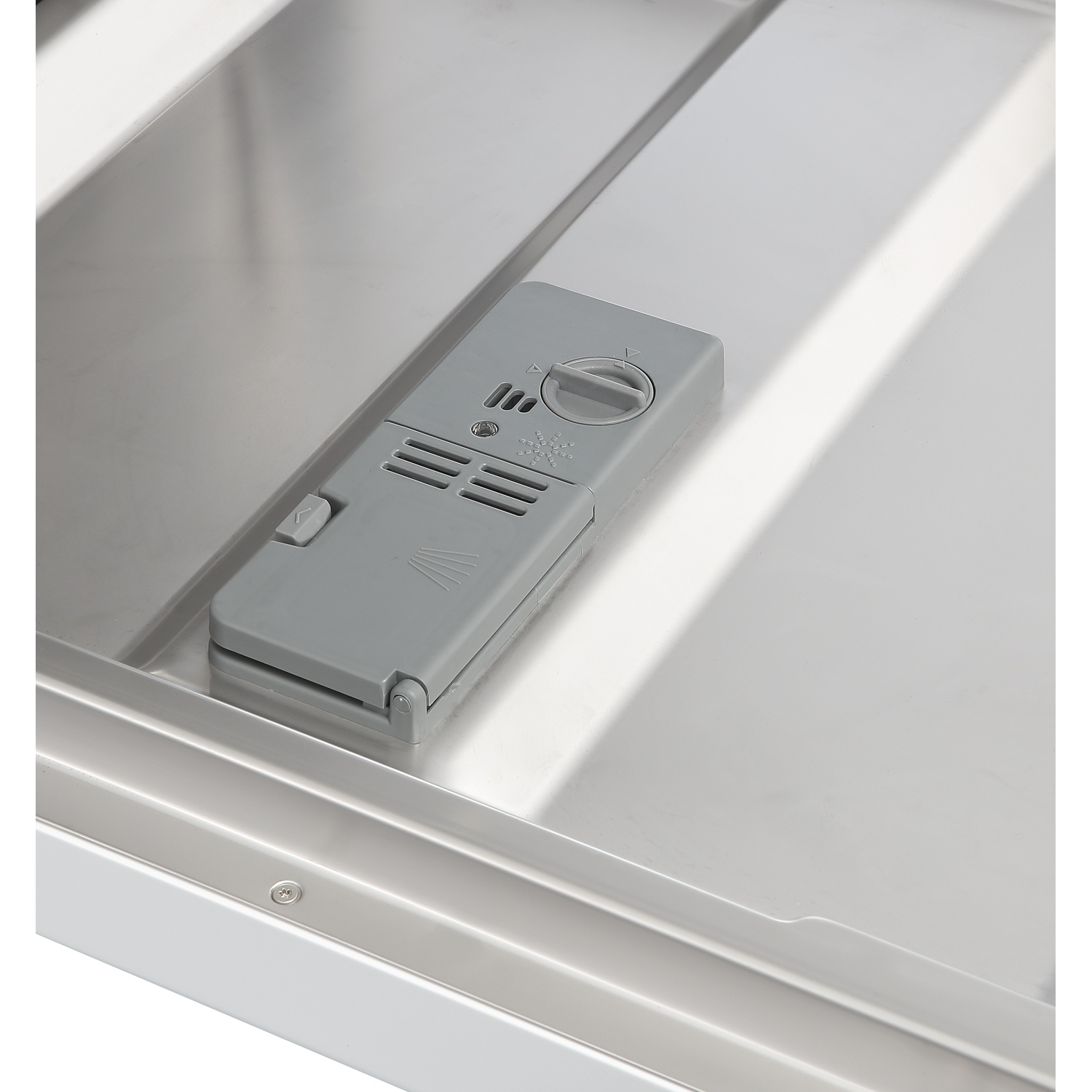 A gray dishwasher detergent dispenser with a rotary dial and vents.