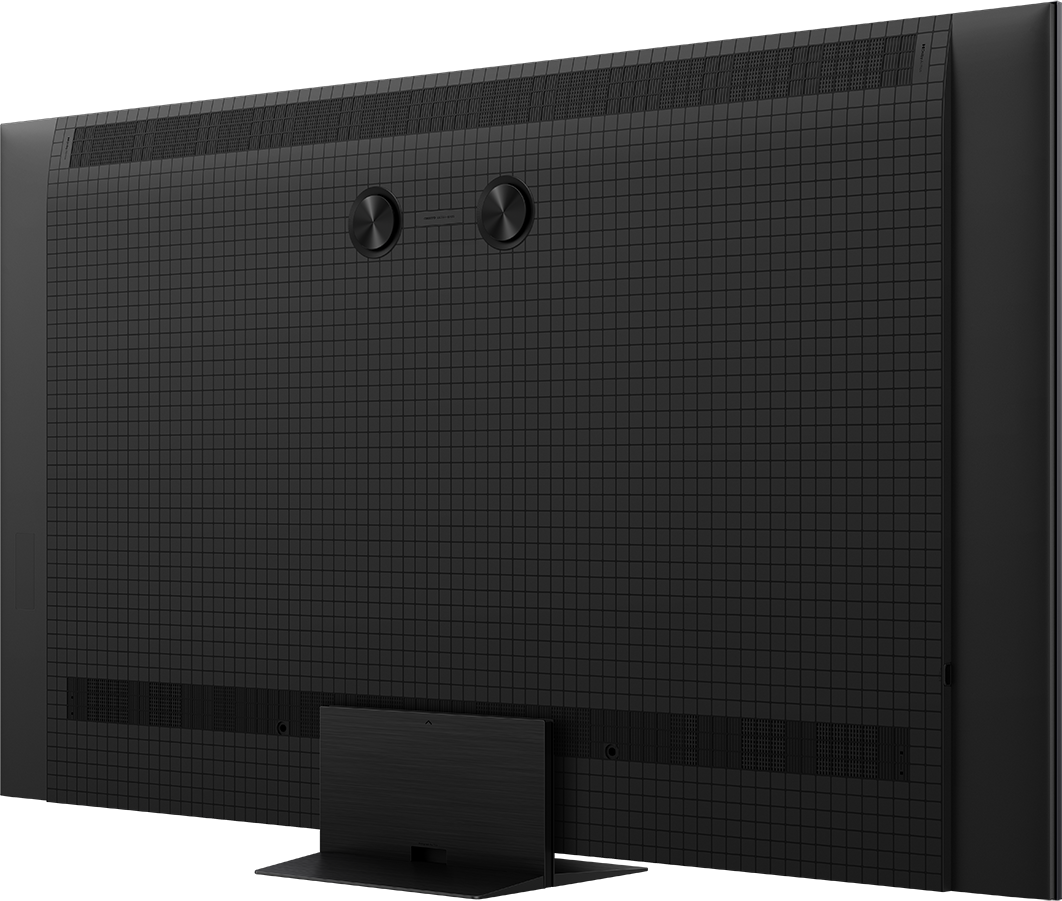 Rückseite eines schwarzen Fernsehers mit gerastertem Muster und Lautsprechergittern.