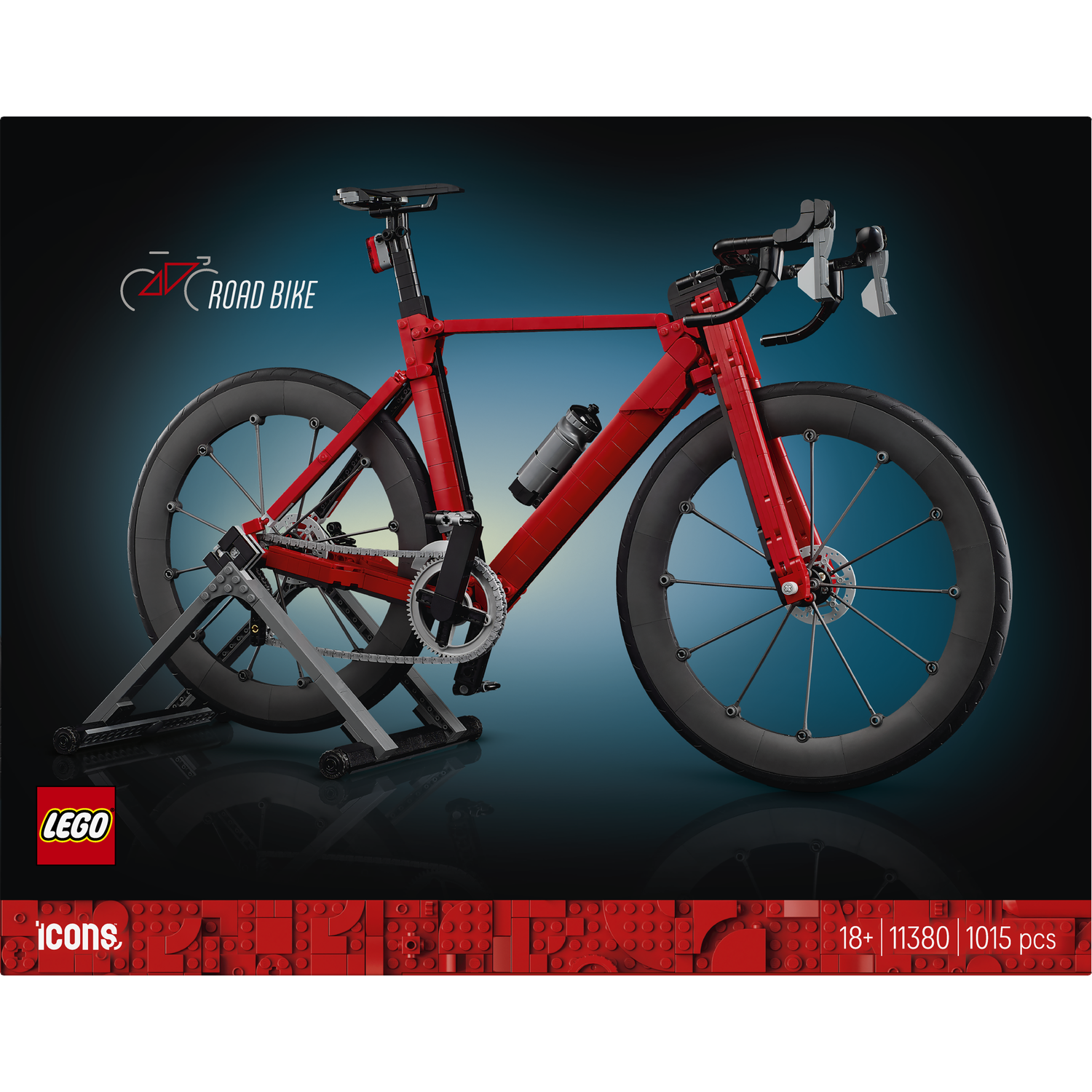 Een rood LEGO racefietsmodel op een standaard, met wielen, velgen en ketting.