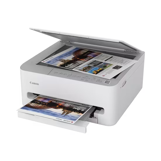 Ein weißer Canon Drucker mit geöffnetem Scannerdeckel und ausgedruckten Seiten.