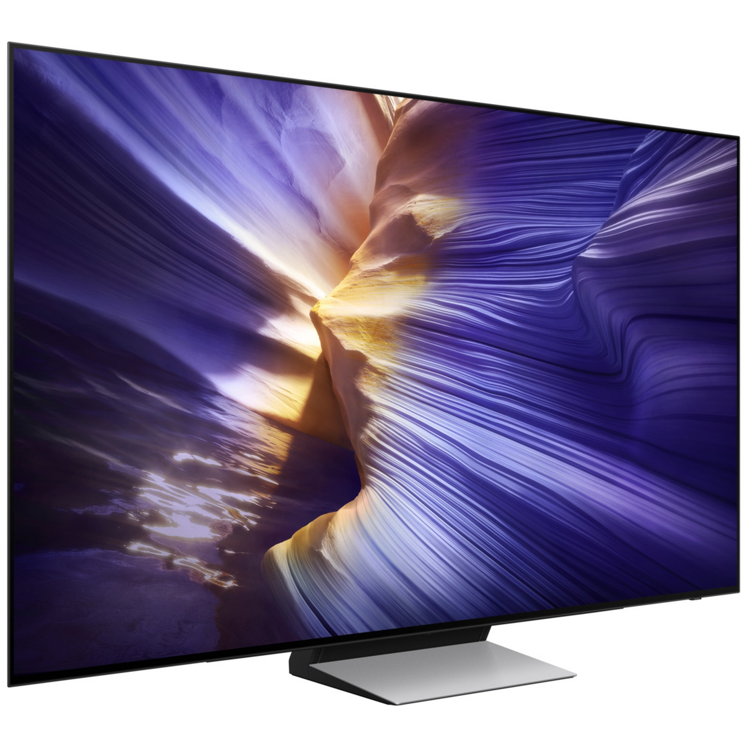 Une télévision moderne affichant une image saisissante d'un canyon déchiqueté aux teintes violettes et dorées.