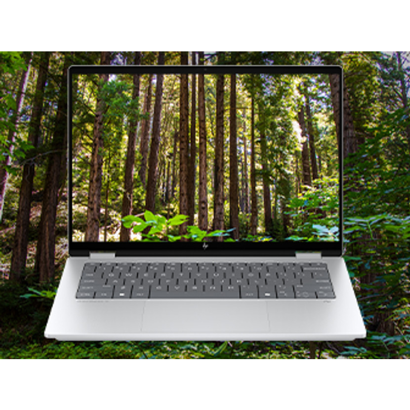 Ein geöffneter Laptop mit einem Waldhintergrund auf dem Bildschirm.