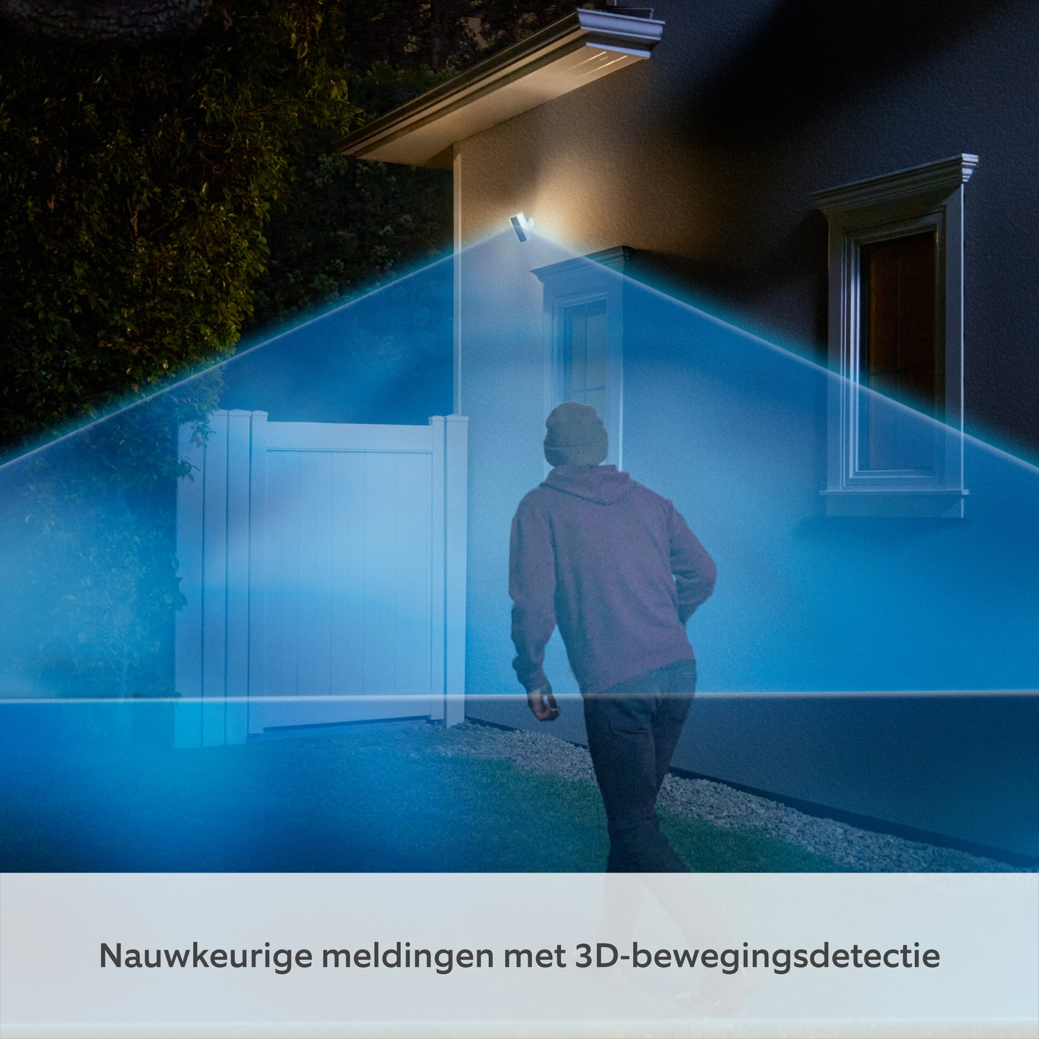 Man in hoodie approaches house, caught in blue light beam detection.