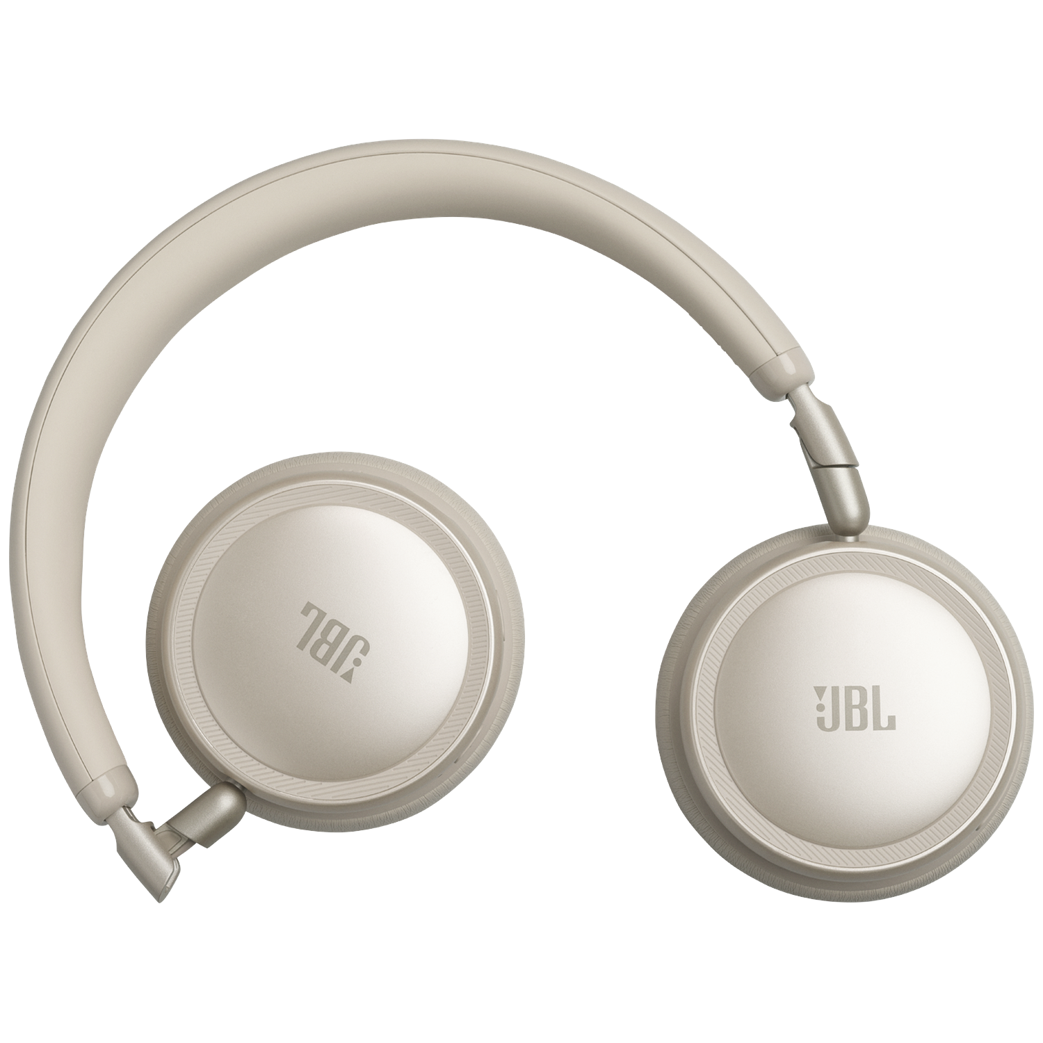 Beige JBL headphones with silver accents on a black background.