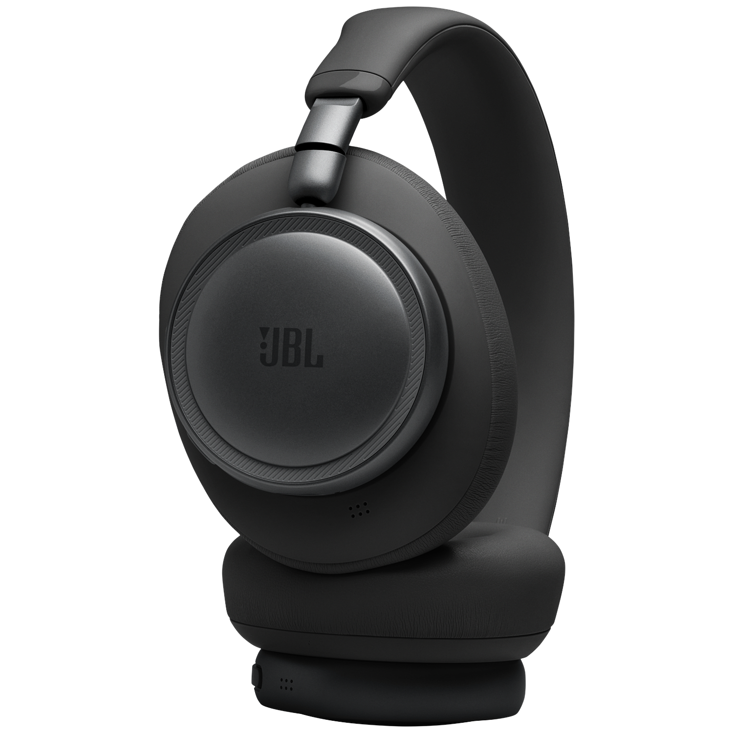 Black JBL headphones with earcups and headband on a black background.
